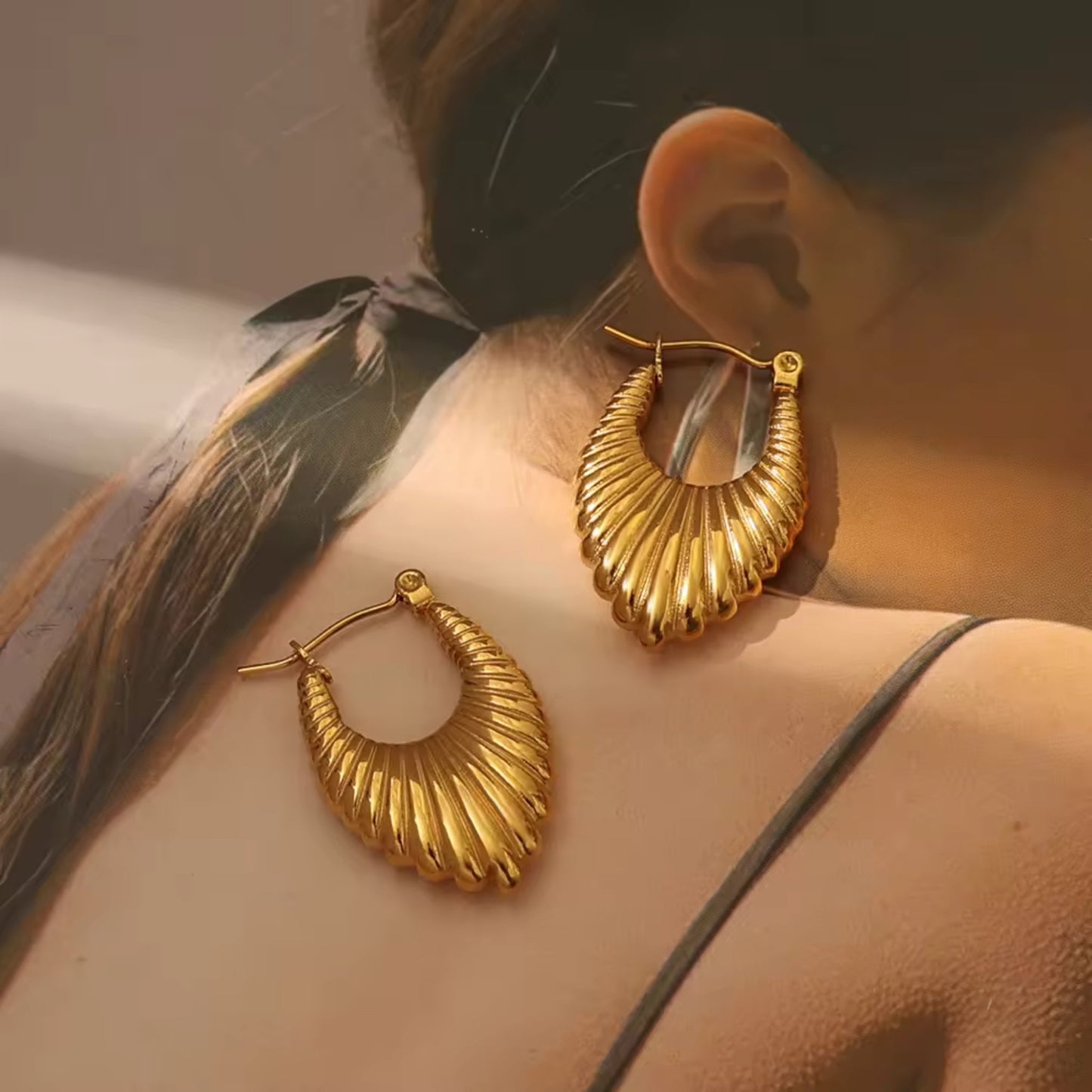 Close-up of 18K Gold Plated Stainless Steel Hoop Earrings showcasing intricate texture and high-quality gold plating.