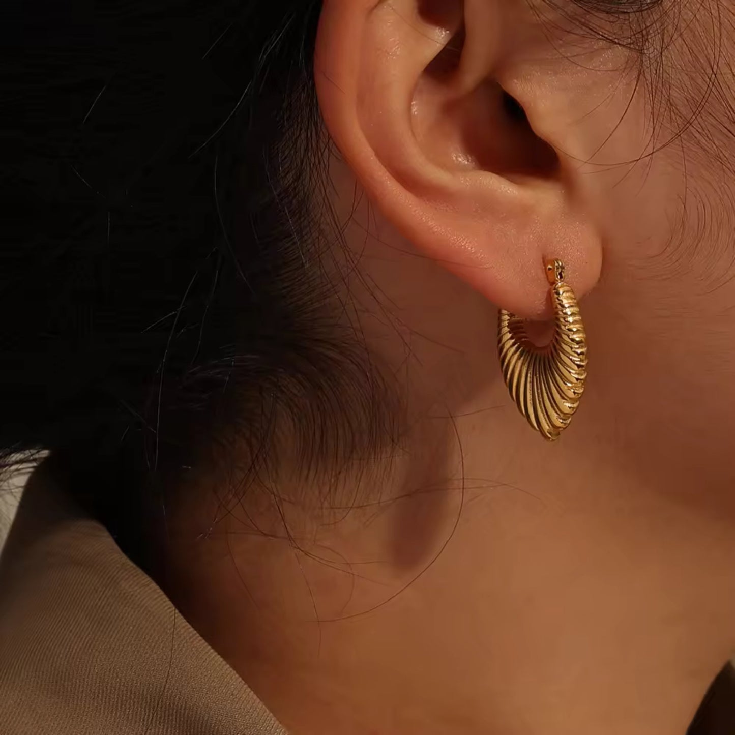 18K Gold Plated Stainless Steel Hoop Earrings with a textured design, shown on a model for a chic and elegant look.