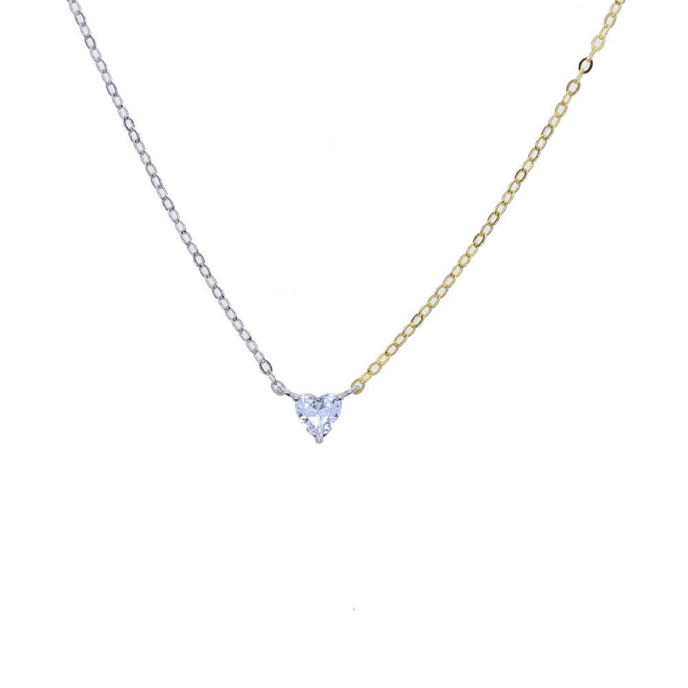 Close-up of the heart-shaped white zirconia pendant on a two-tone chain with 18K gold and silver platinum plating.