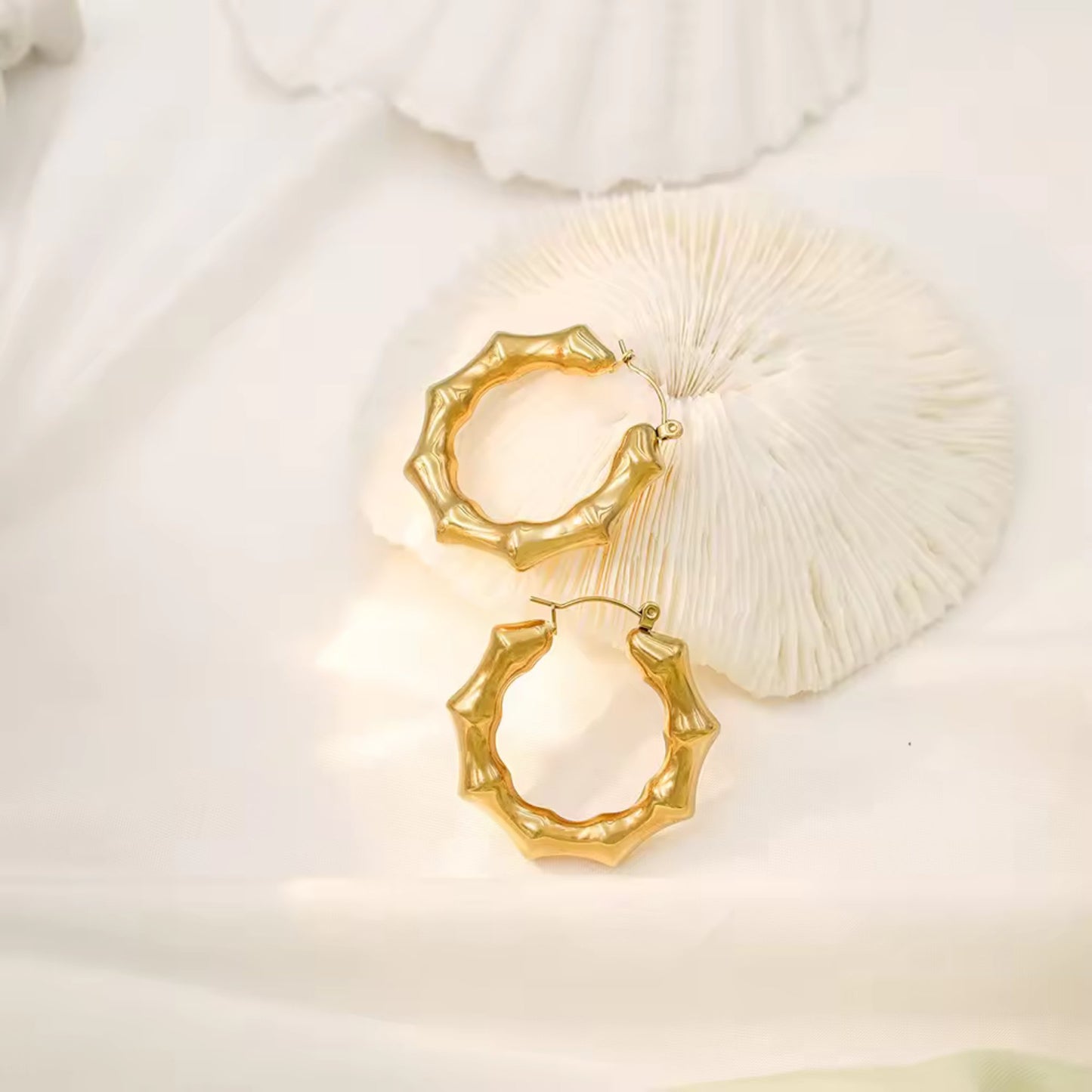 Bamboo Twist Hoop Earrings styled for a natural yet sophisticated look, perfect for any occasion.