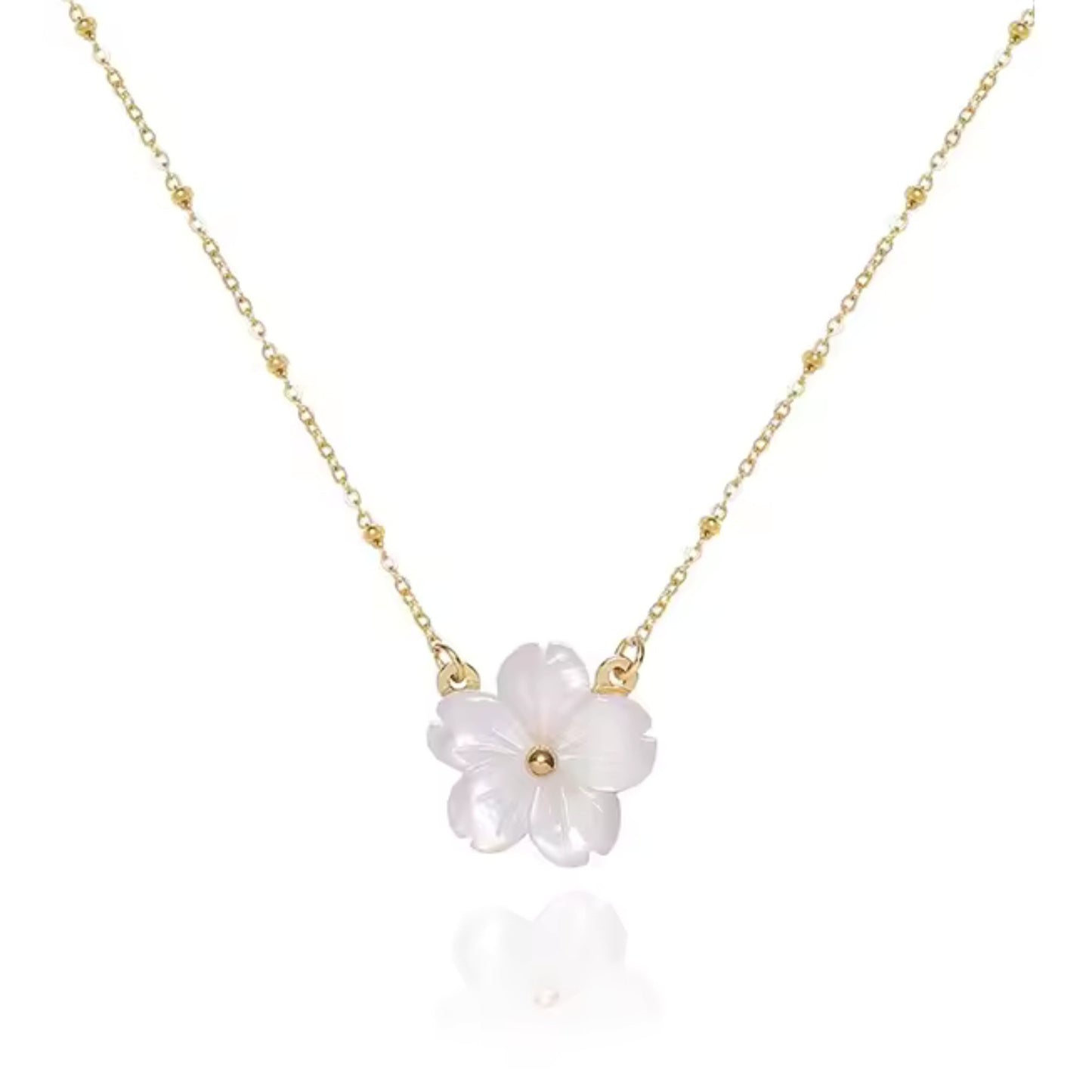 Blossom Beauty Flower Necklace with a delicate mother of pearl flower pendant and 18K gold-plated stainless steel beaded chain.