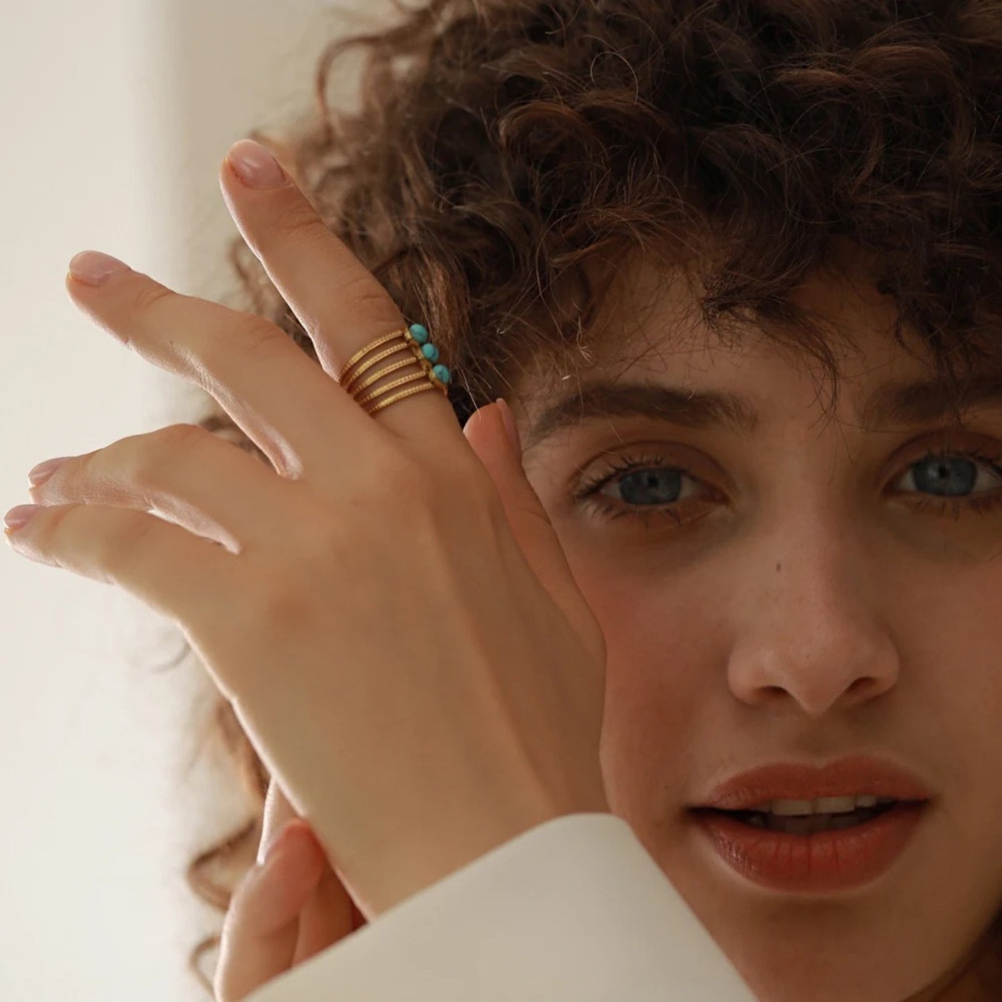 Boho Breeze Turquoise Multi-Layer Ring featuring natural turquoise stones and intricate multi-layered design.