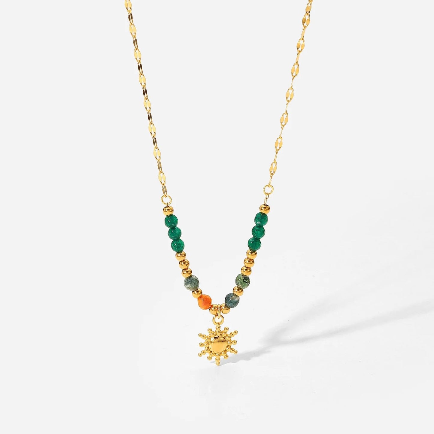 Boho Sun Pendant Necklace with green and orange semi-precious stones, a dazzling sun pendant, and 18K gold-plated chain.