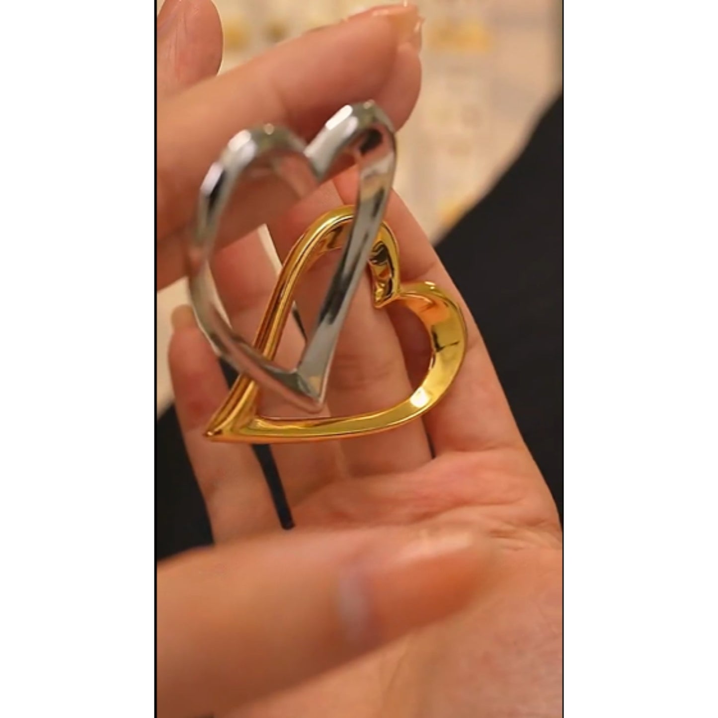 Bold Open-Heart Statement Earrings in gold and silver-tone finishes, highlighting their sleek and modern design.