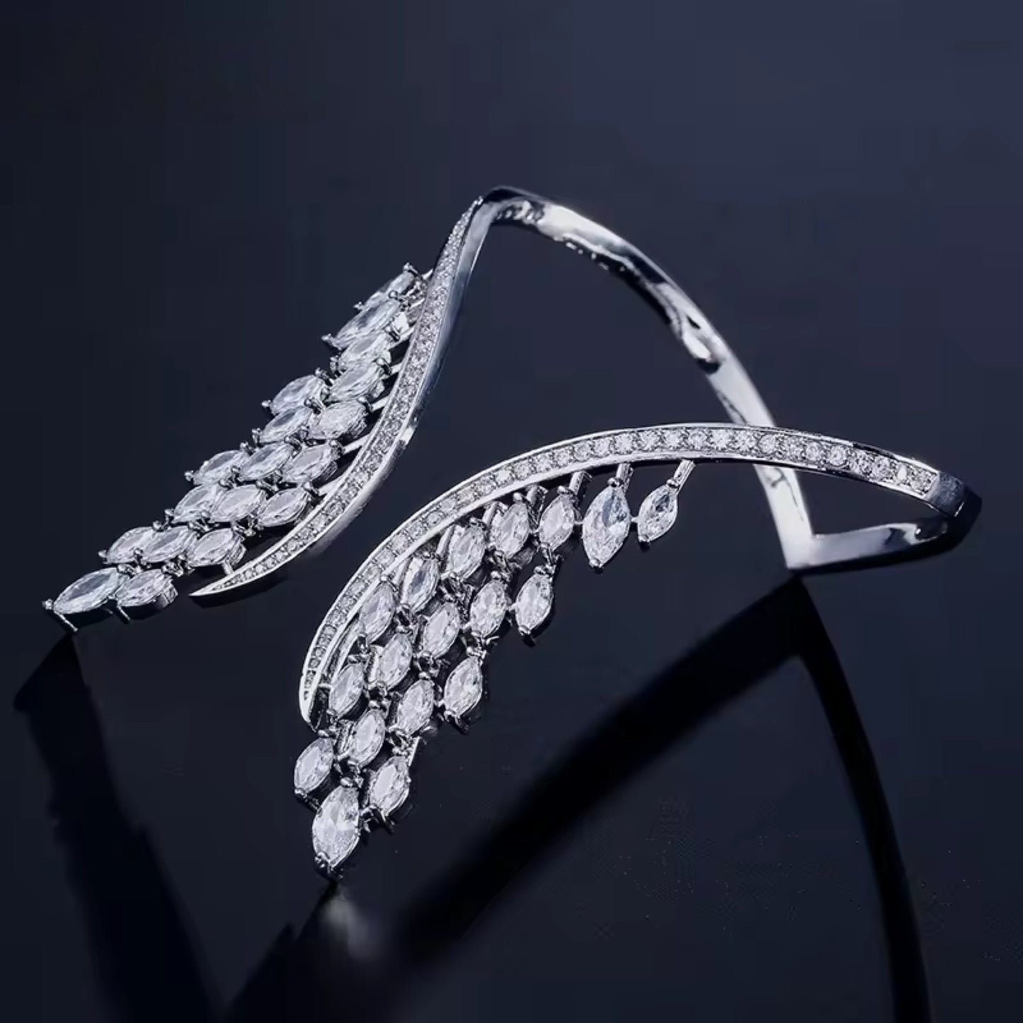 Close-up of the intricate wing design on the Celestial Wings Adjustable Zircon Ring, adorned with dazzling zircon stones.
