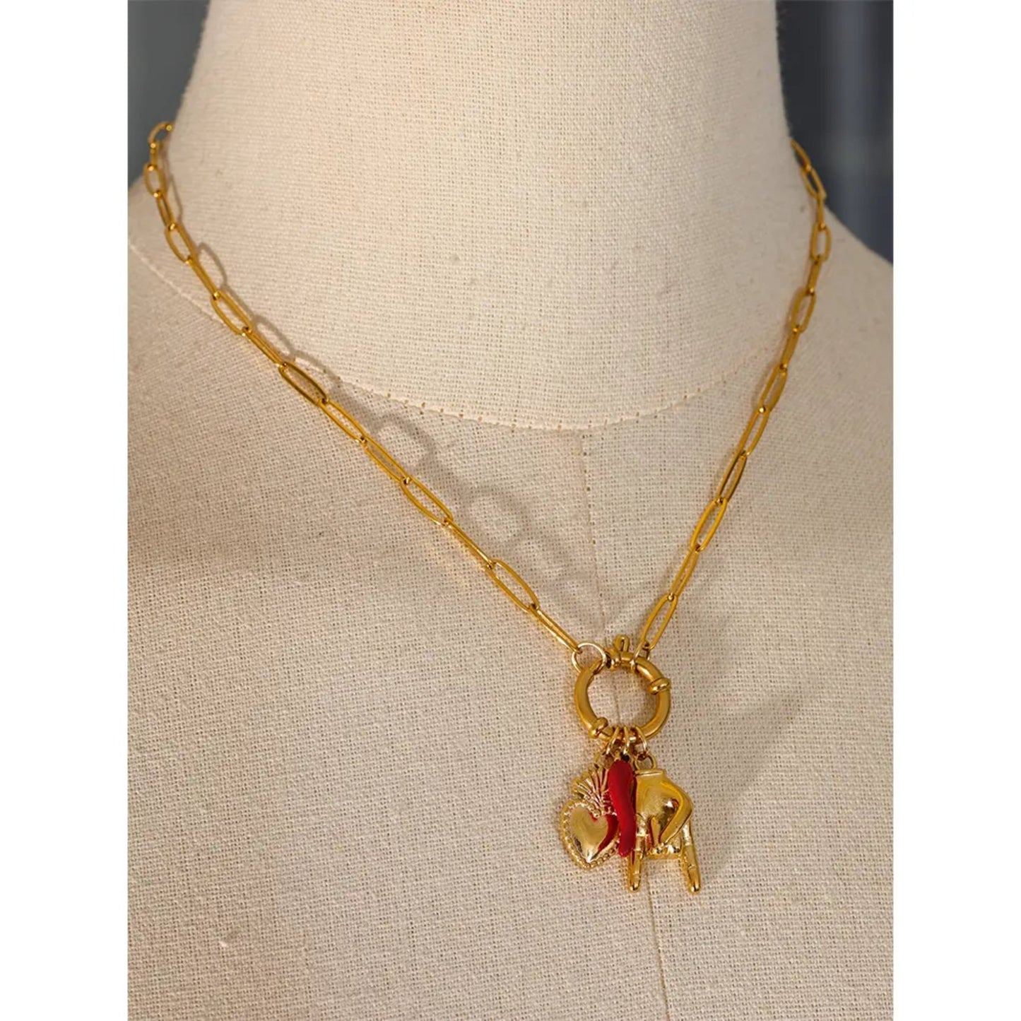 Charm of Fortune Necklace styled on a model, showcasing its bold and eclectic design with symbolic gold-plated charms.