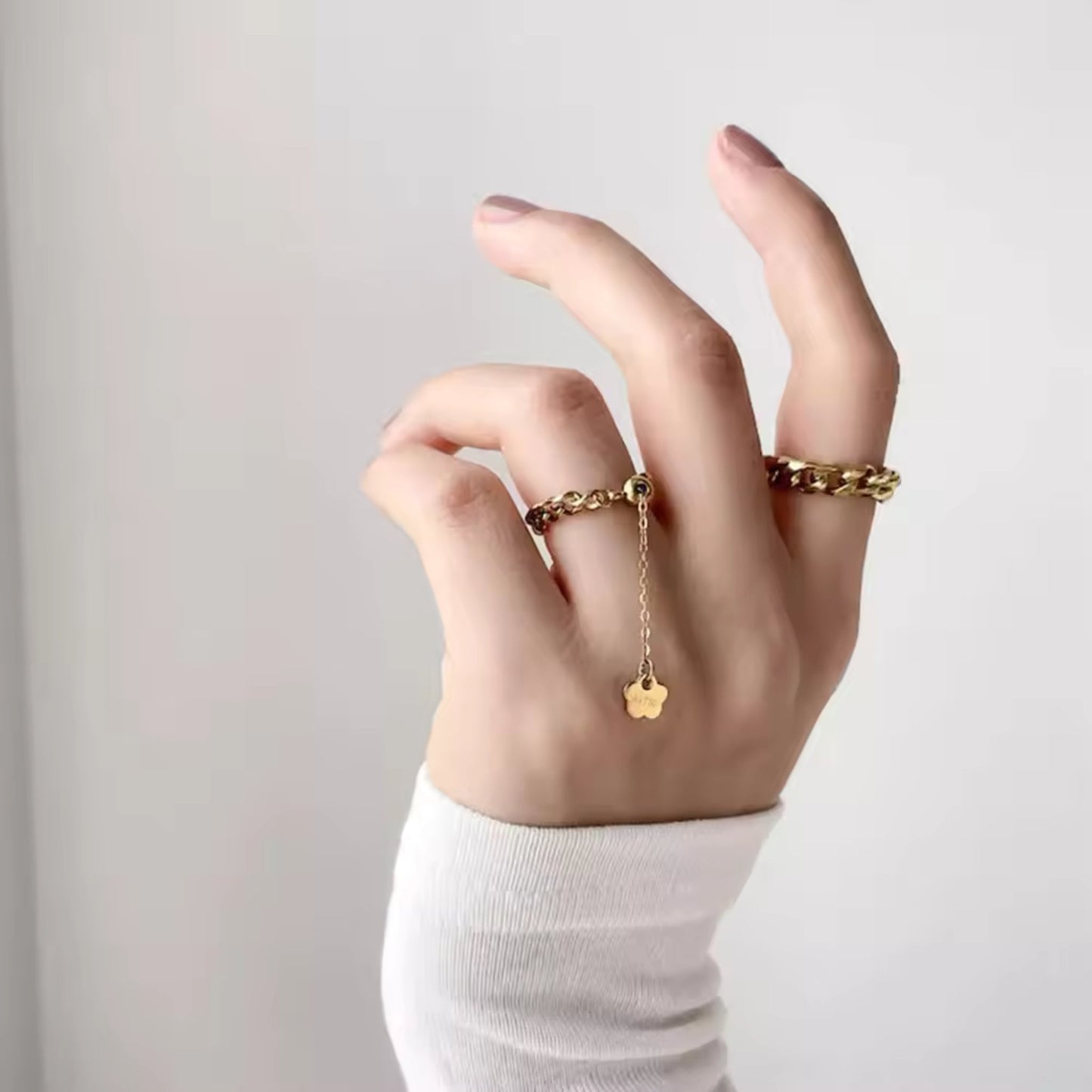 CharmLink Adjustable Duo Ring Set styled on fingers, featuring the pearl-accented and chain-link rings for a modern, elegant look.