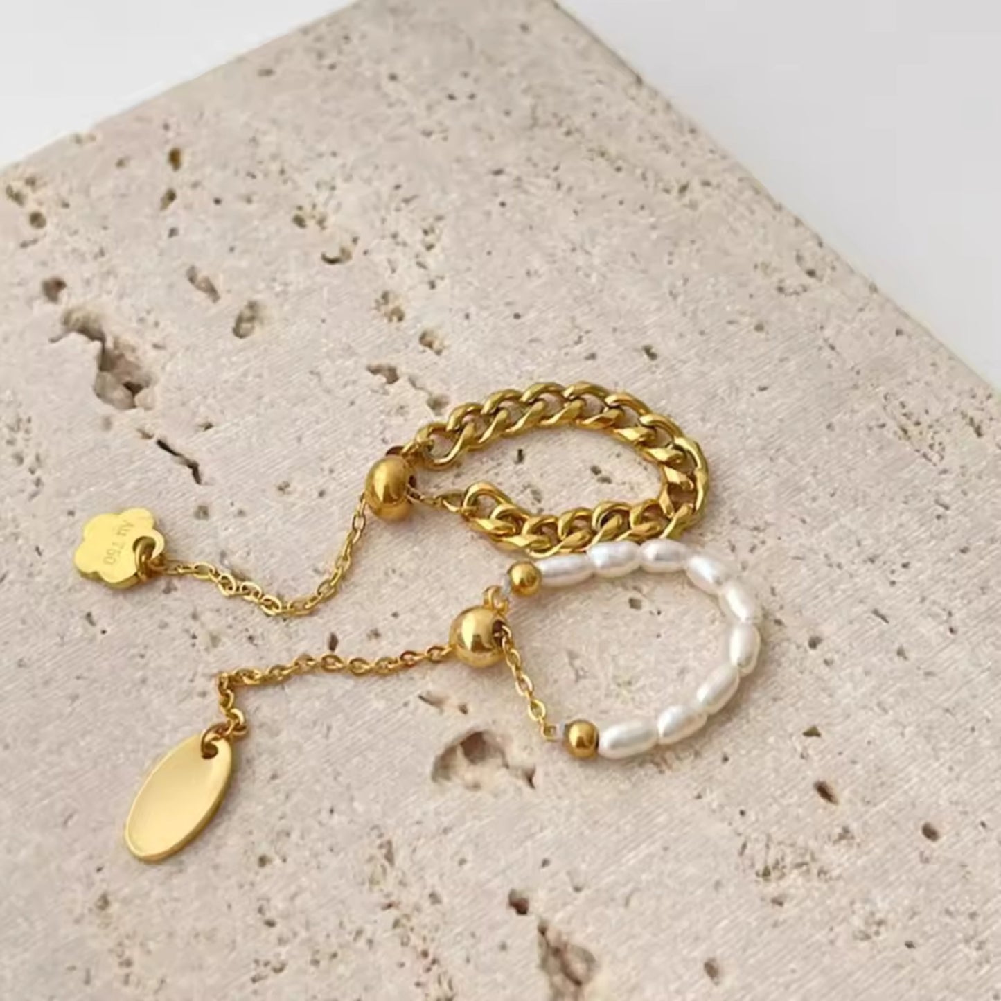 CharmLink Adjustable Duo Ring Set with pearl-accented and chain-link designs, crafted in 18K gold-plated stainless steel.