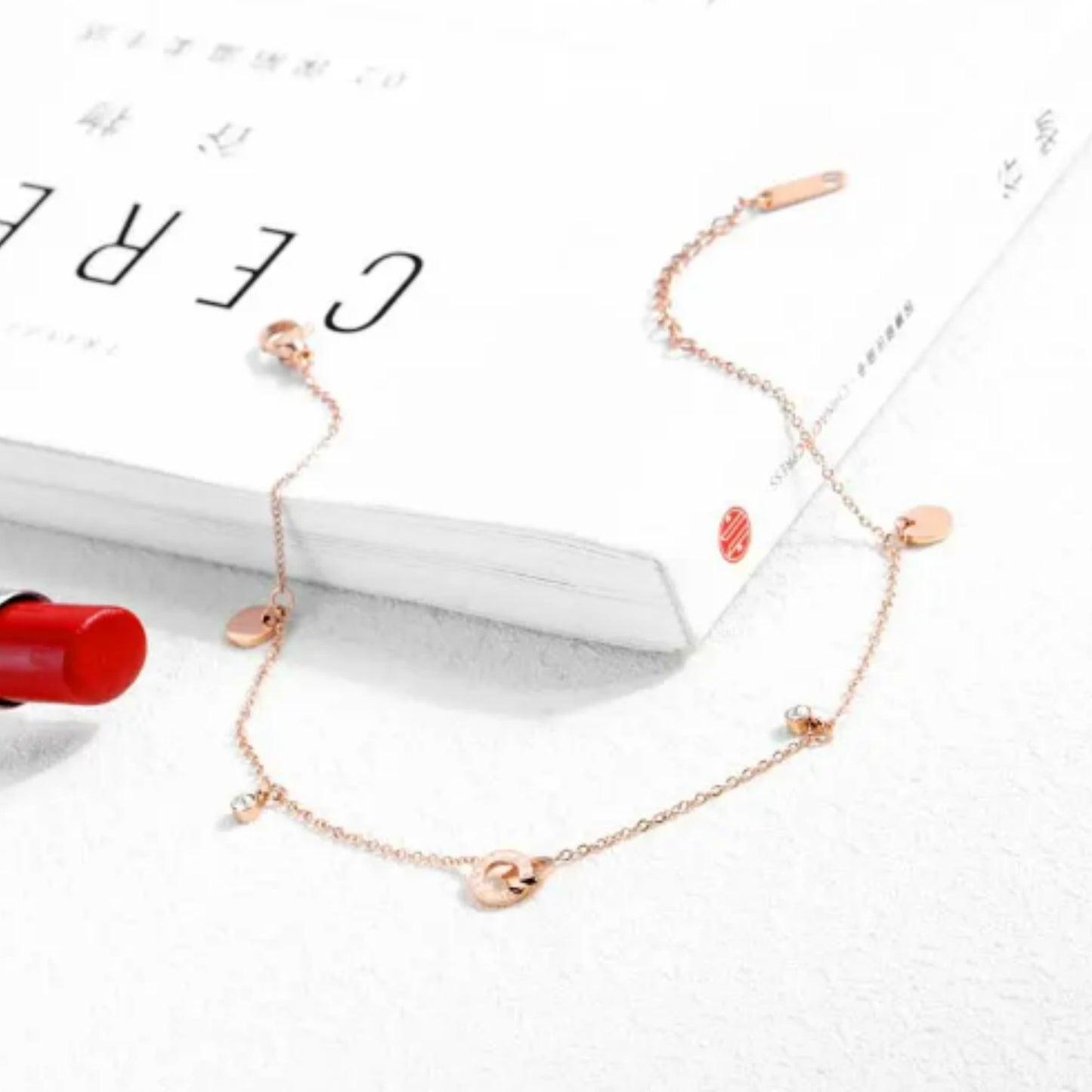 Close-up of the Circle of Love Anklet showcasing its interlocking rings, round charms, and white zircon accents.