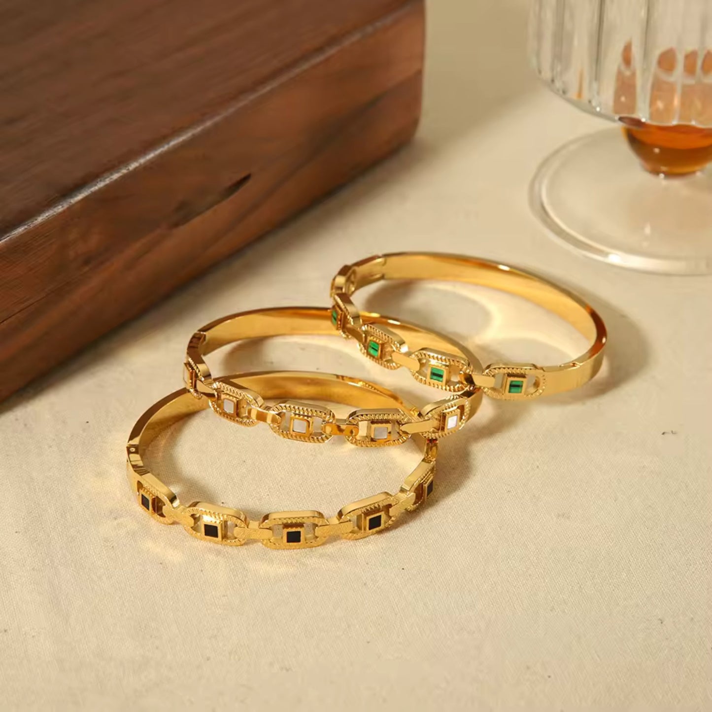 Classic Chain-Link Gold Bangle in three versatile colors: Black, Green, and White, accented with 18K gold plating.