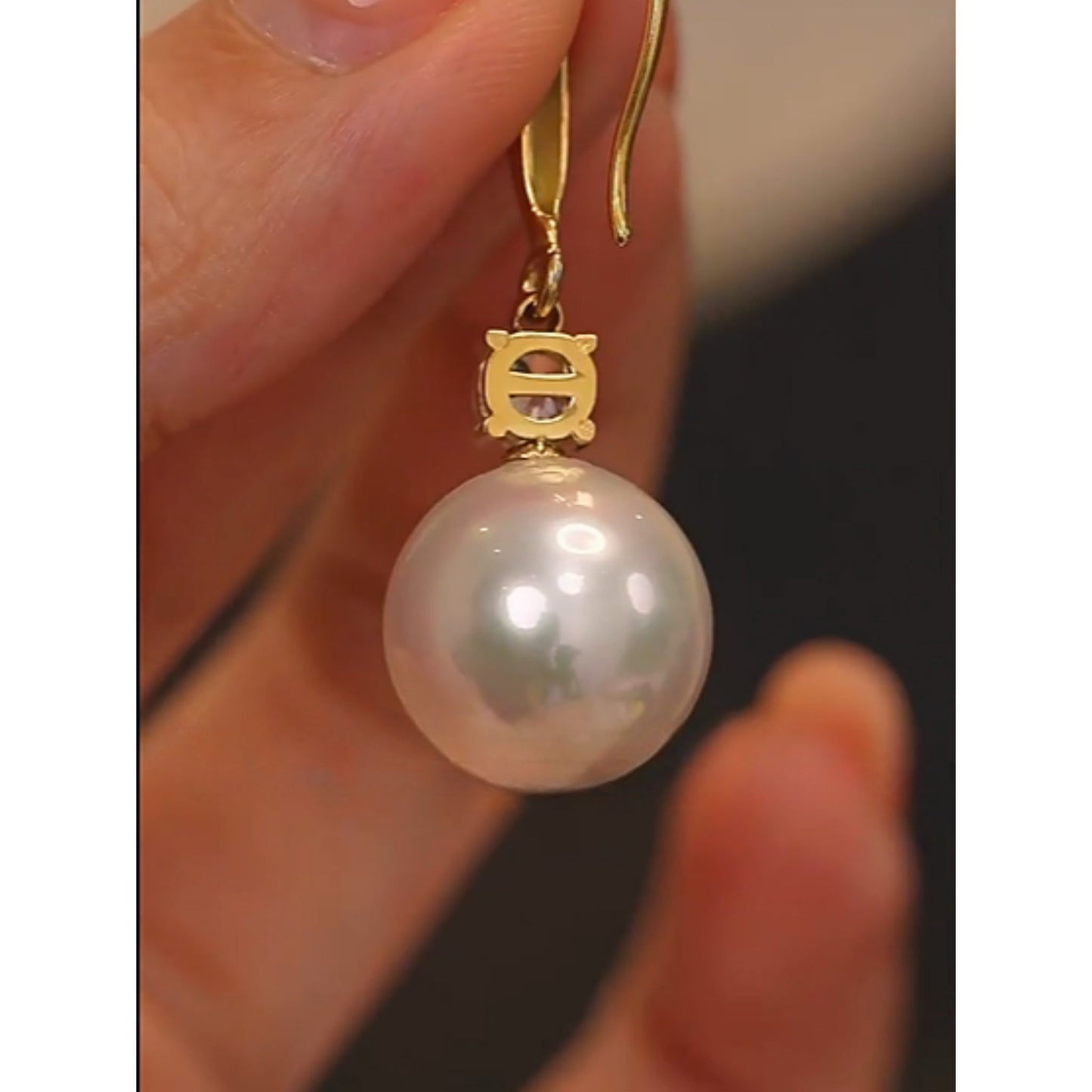 Side view of the Classic Pearl Drop Earrings, showing the secure back closure and intricate design details.