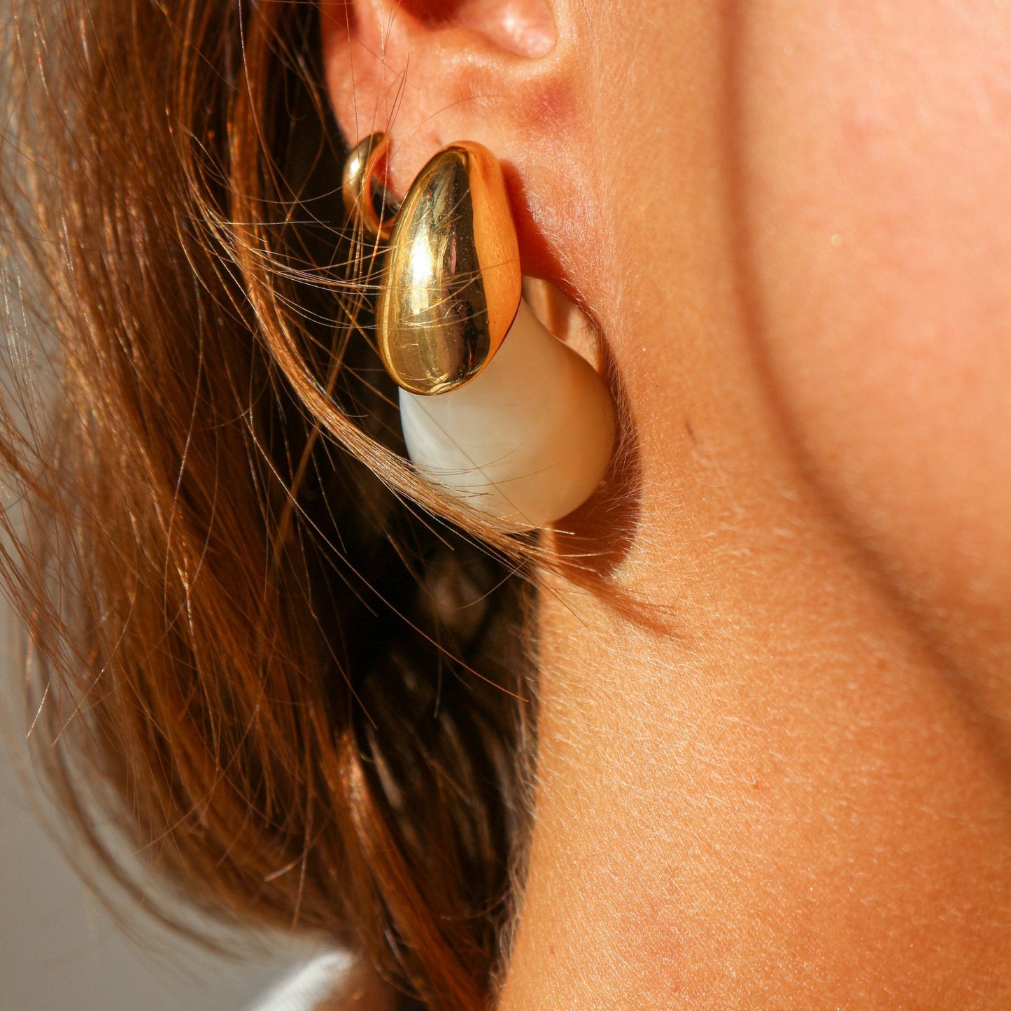 Color Splash Gold-Tipped Drop Earrings styled on a model, highlighting their vibrant color and chic drop design.