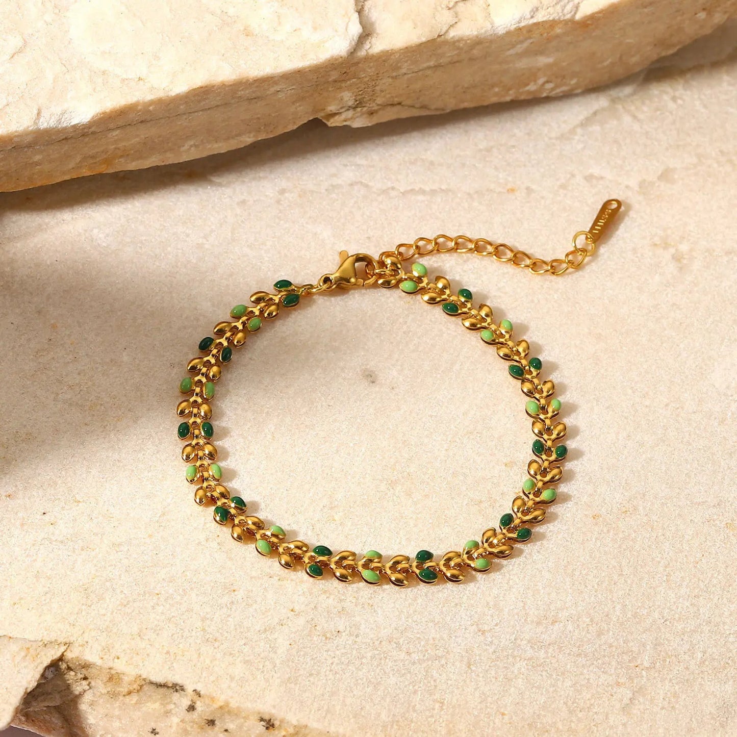 Close-up of the delicate leaf-shaped links with colorful oil drop accents on the Colorful Leaf Drop Bracelet.