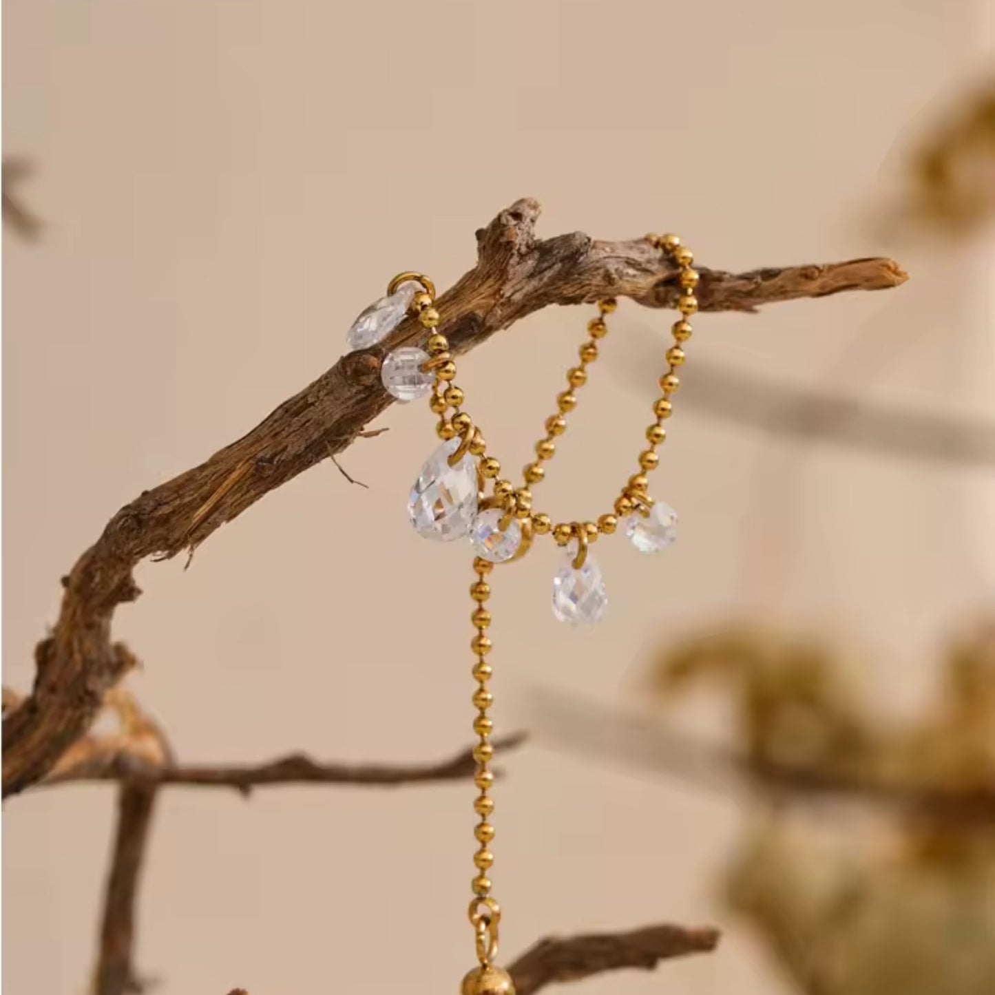 Close-up of the adjustable slider on the Crystal Charm Beaded Ring for a custom fit.