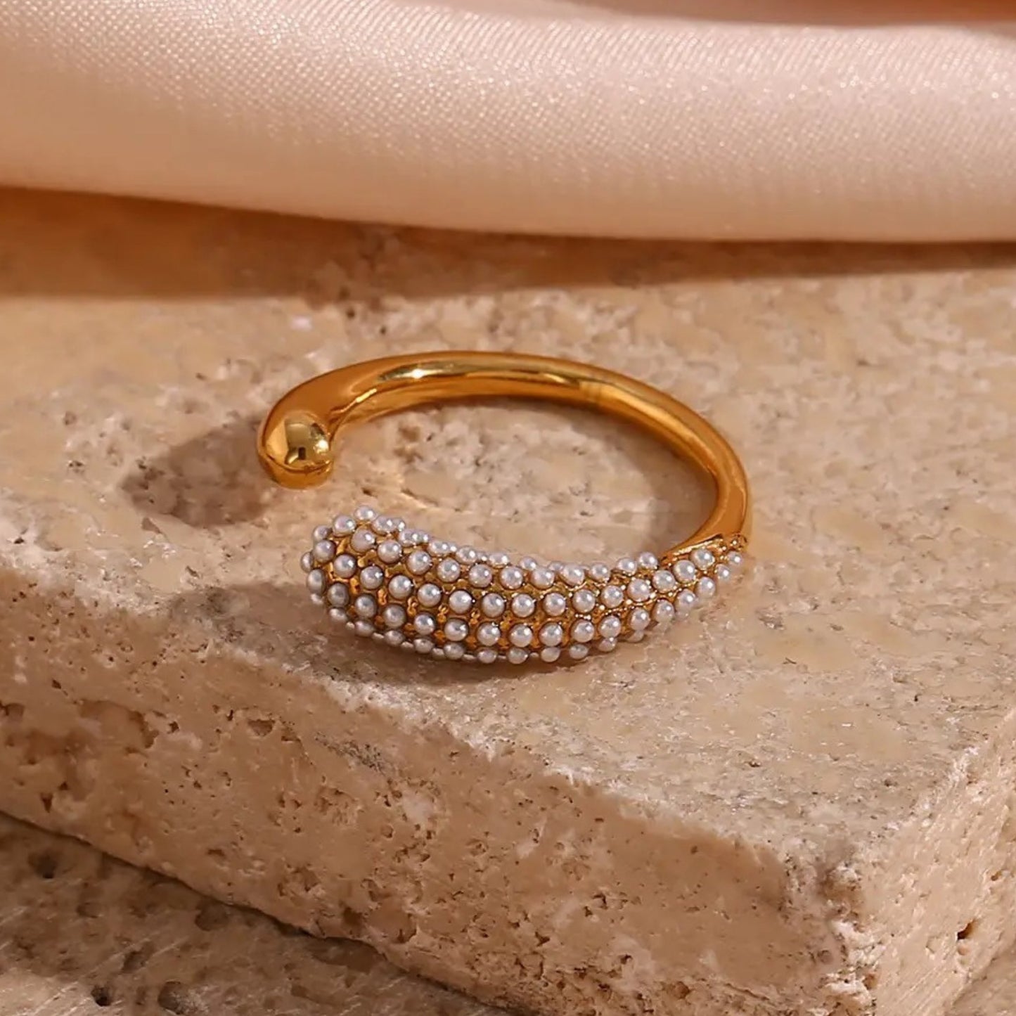 Side view of the Crystal Curve Adjustable Ring, showing the open band design for a comfortable fit.