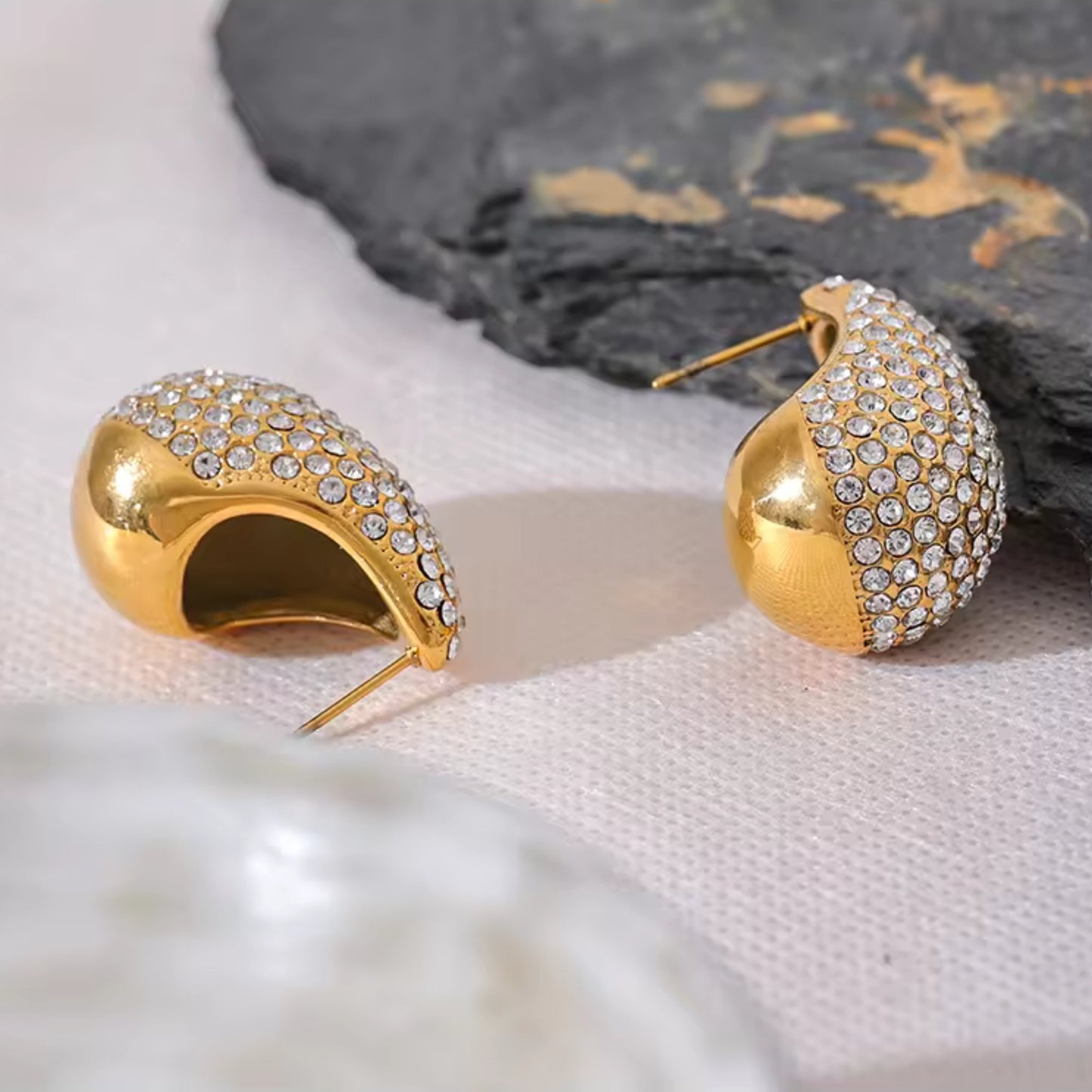 Close-Up view of the Crystal Embellished Gold Teardrop Earrings.