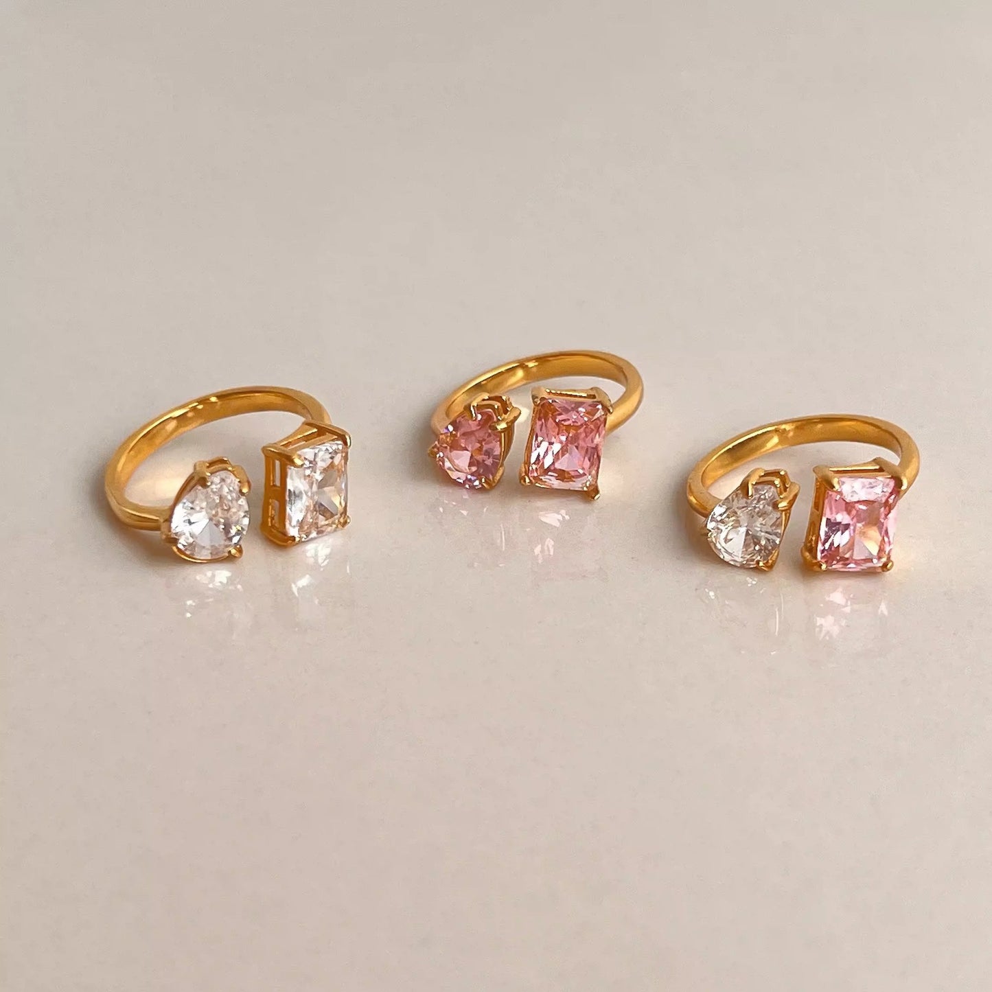 Pink and white zircon Dual Delight Ring with an adjustable band and sleek gold-plated finish.