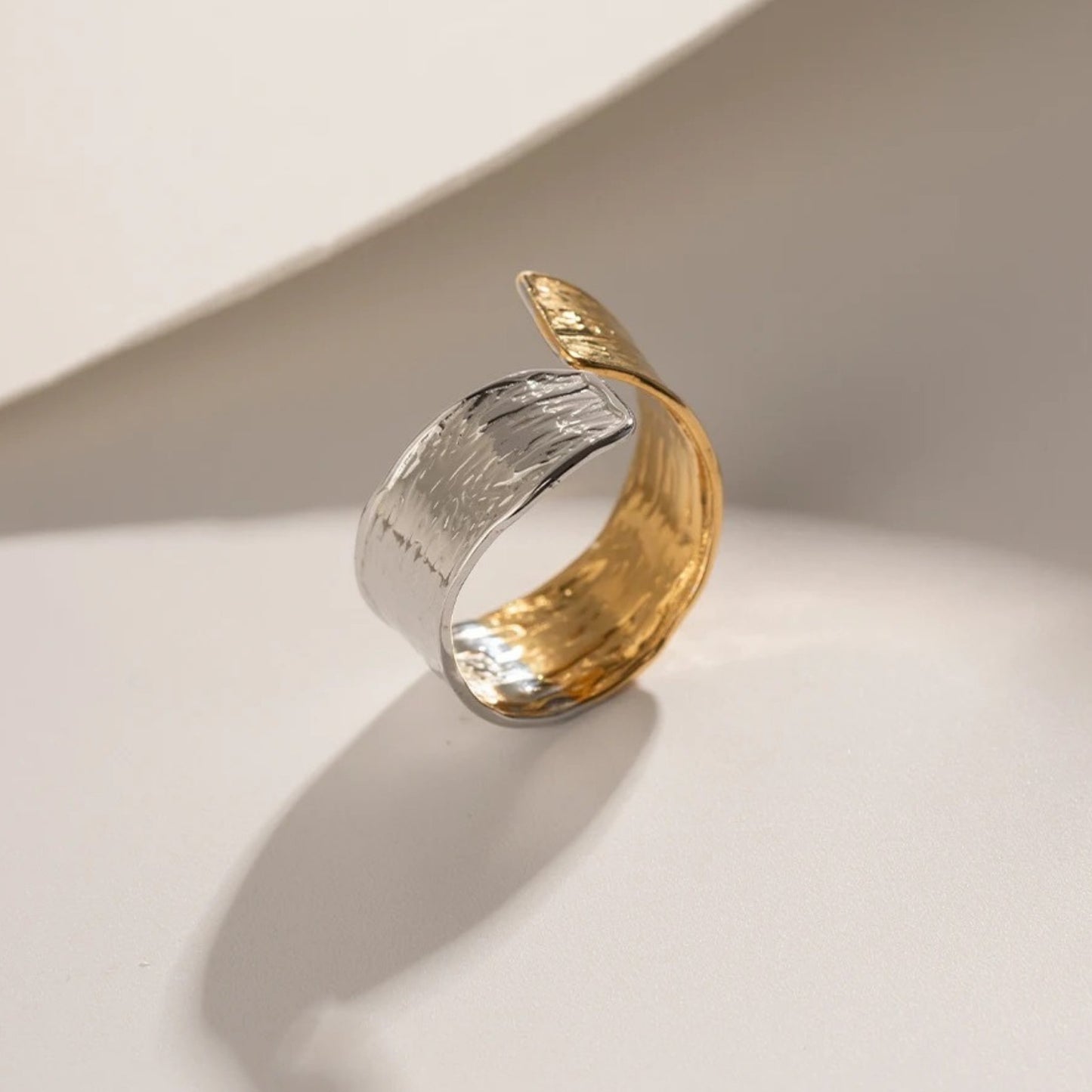 Close-up of the textured pattern on the Dual Tone Adjustable Ring, crafted with 18K gold and silver plating.