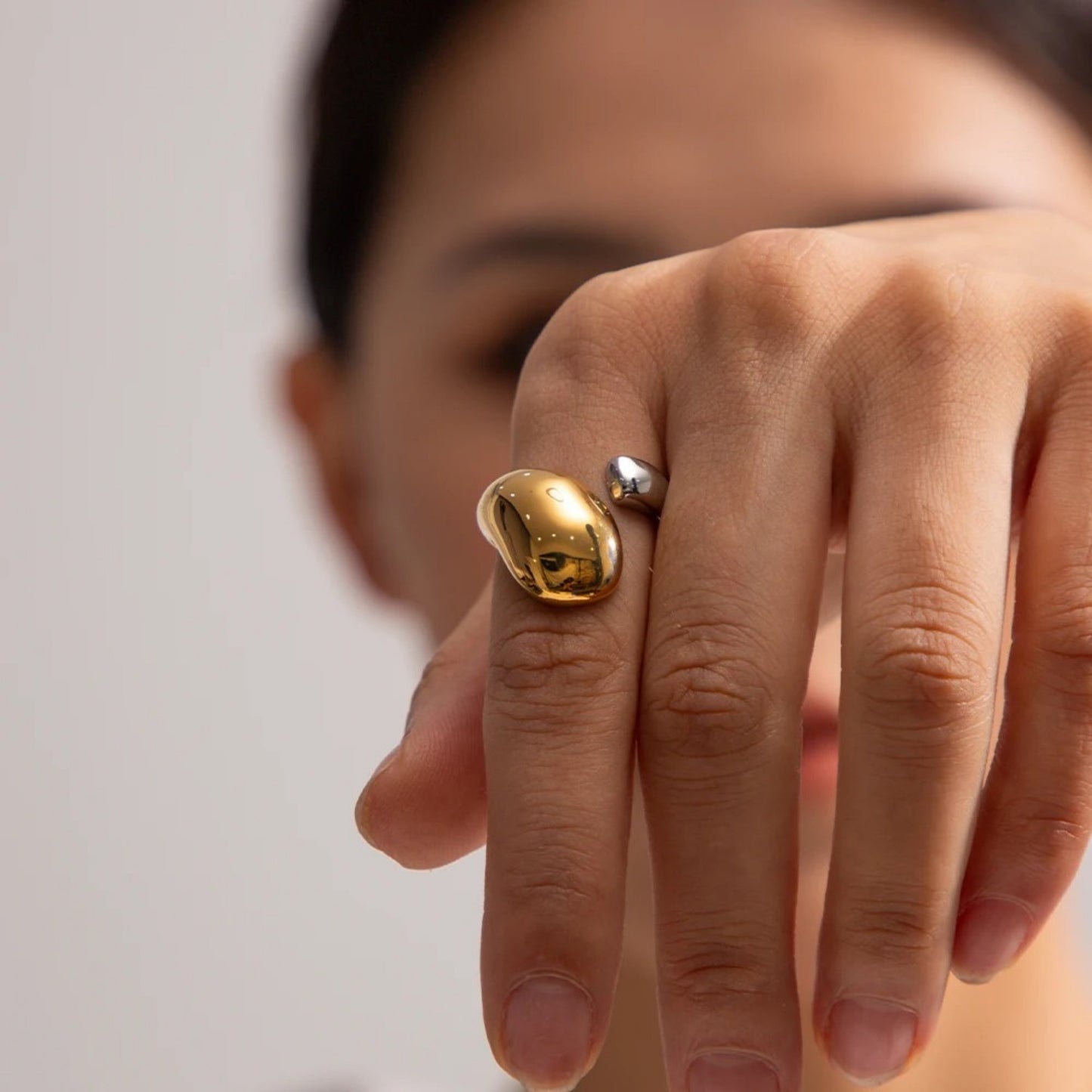Model wearing the Dual-Tone Water Drop Ring, highlighting its bold and elegant design.