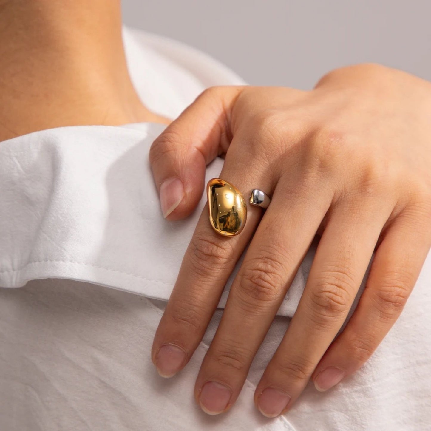 Side view of the Dual-Tone Water Drop Statement Ring, showing the adjustable fit and dual-tone finish.