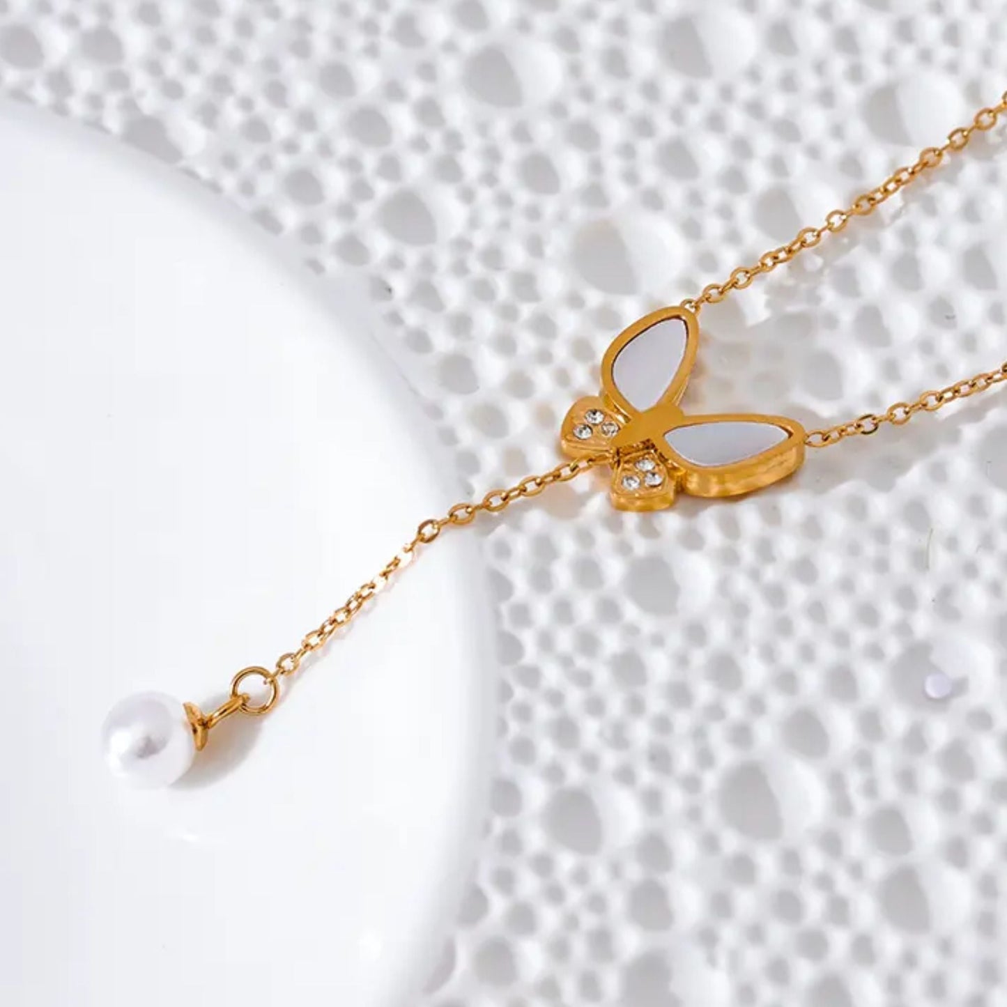 Side View of Butterfly Pendant with Zircon and Pearl Detail