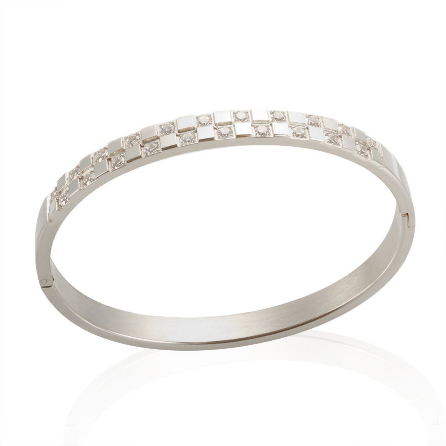 Elegant silver-plated stainless steel cuff bracelet featuring a sleek design with sparkling cubic zirconia stones, laid out on a white background.