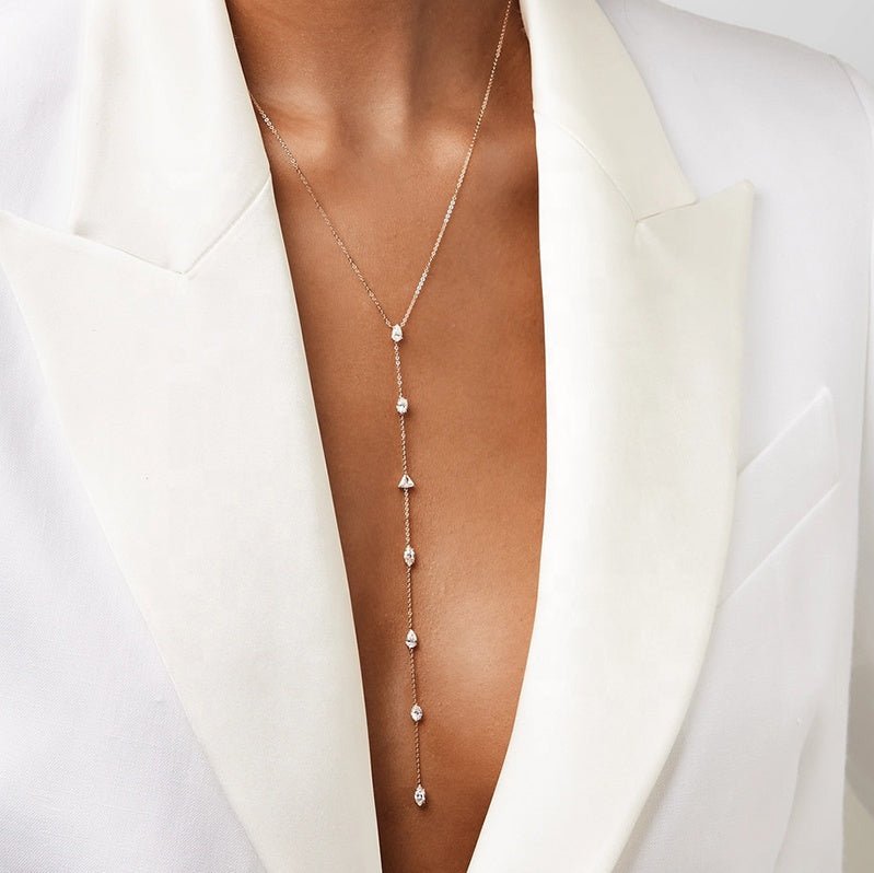 Model wearing the Eternal Elegance Y-Shape Necklace, flattering silhouette, gold finish, and dazzling zircon details.