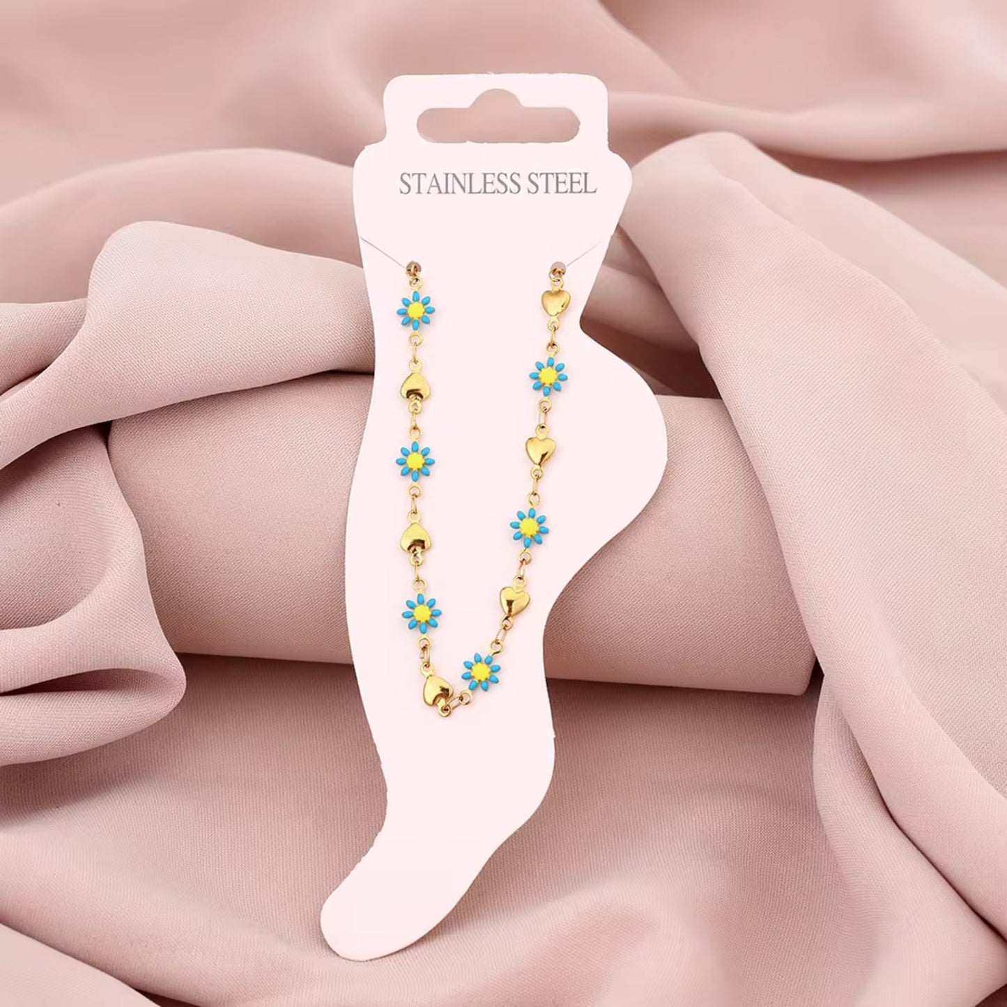 Floral Evil Eye Waterproof Charm Anklet displayed flat, highlighting its vibrant charms and adjustable design.
