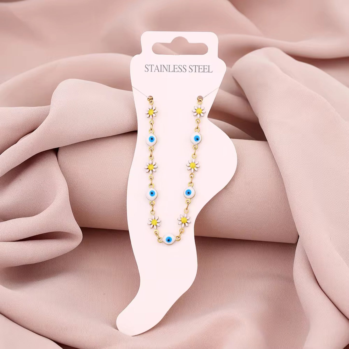 Floral Evil Eye Waterproof Charm Anklet displayed flat, highlighting its vibrant charms and adjustable design.