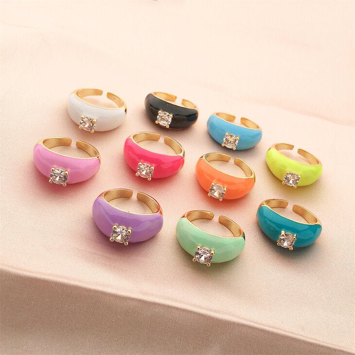 Set of 18K Gold Plated Oil Dripping Cubic Zirconia Rings in Orange, Yellow, Purple, and Turquoise.