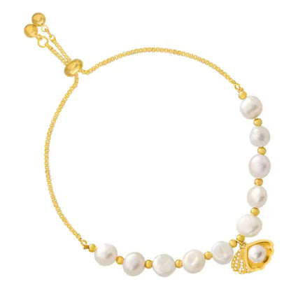 White background of Adjustable White Pearl Braided Bracelet featuring braided design, rhinestone inlays, and a shell charm.