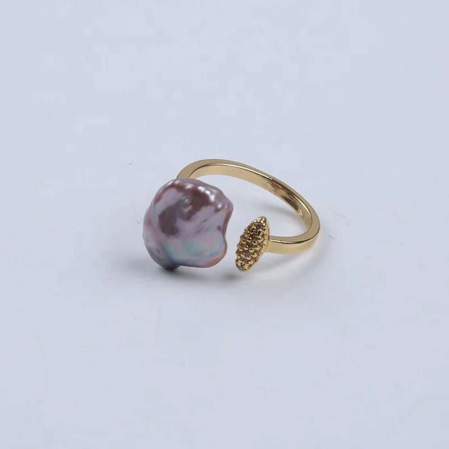 Adjustable ring with an iridescent baroque freshwater pearl and a handcrafted wire-wrapped 18K gold-plated band