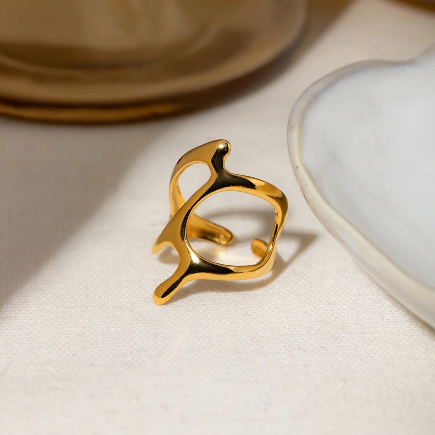 Modern Avant-Garde Open Ring styled on a hand, adding a bold statement to any look.