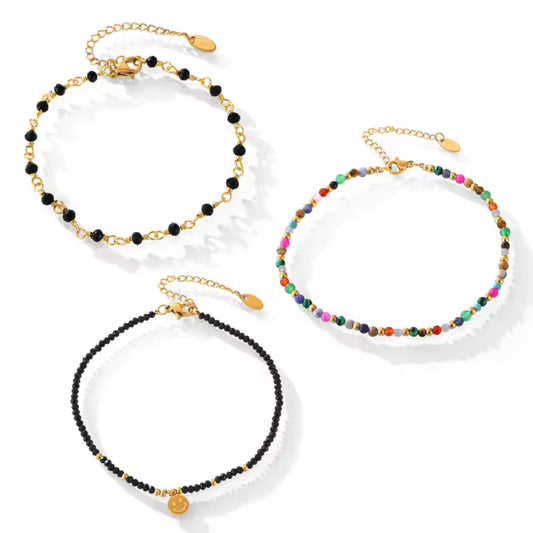 Set of three Beaded Charm 18K Gold Plated Anklets with unique colorful bead designs and durable gold-plated stainless steel.