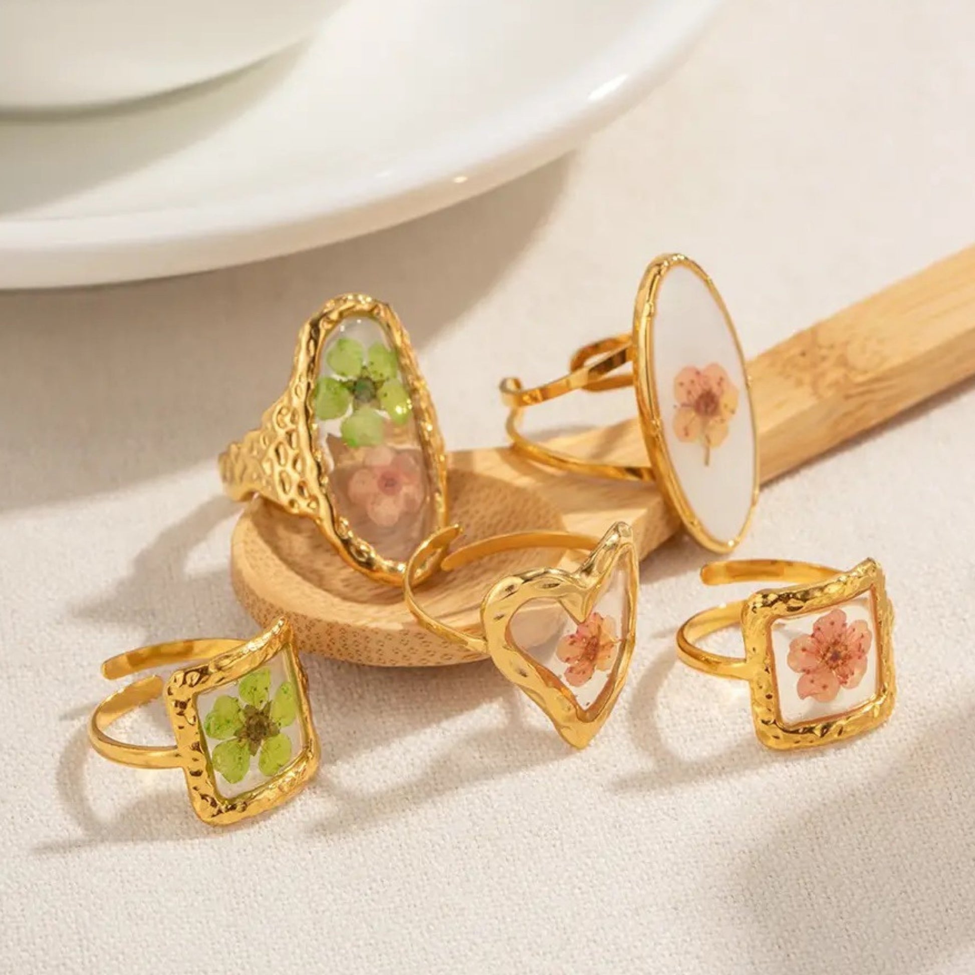 Close-up of Blooming Elegance Floral Open Ring highlighting its pressed flower detailing and intricate 18K gold-plated craftsmanship.