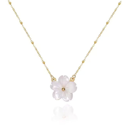 Blossom Beauty Flower Necklace with a delicate mother of pearl flower pendant and 18K gold-plated stainless steel beaded chain.
