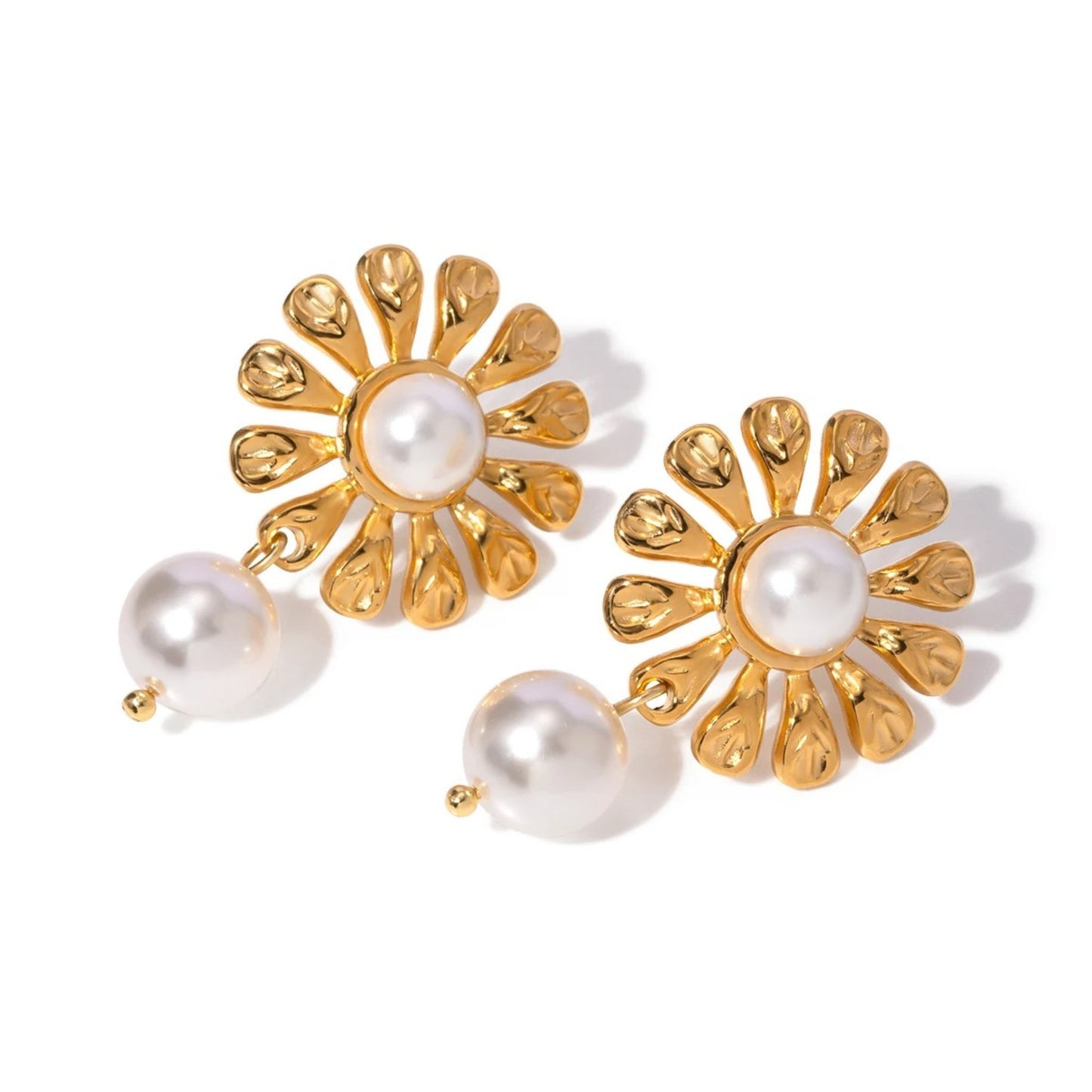 Close-up of Blossom Pearl Drop Earrings showcasing intricate floral motifs and dangling pearl drops.