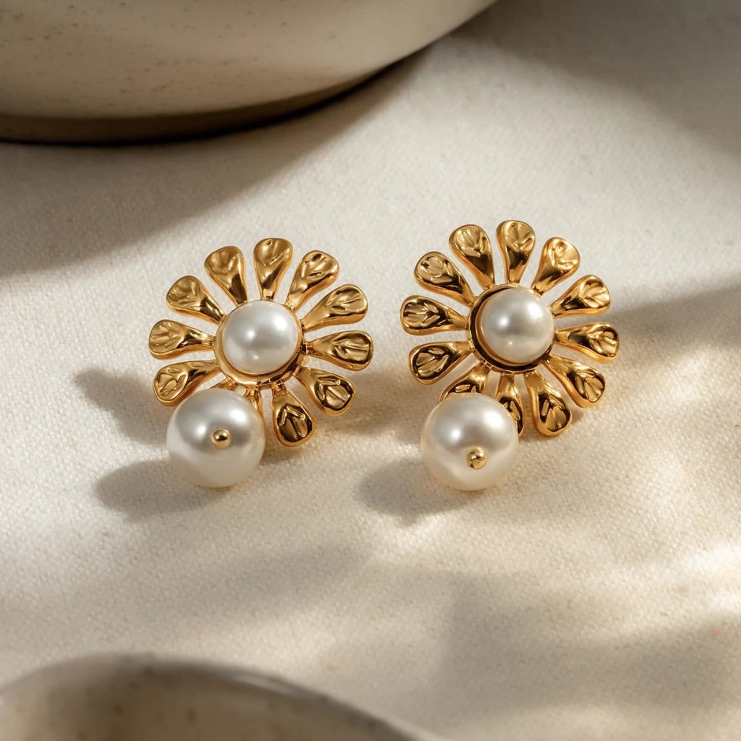 Blossom Pearl Drop Earrings featuring floral design with freshwater pearls and 18K gold plating, exuding timeless elegance.