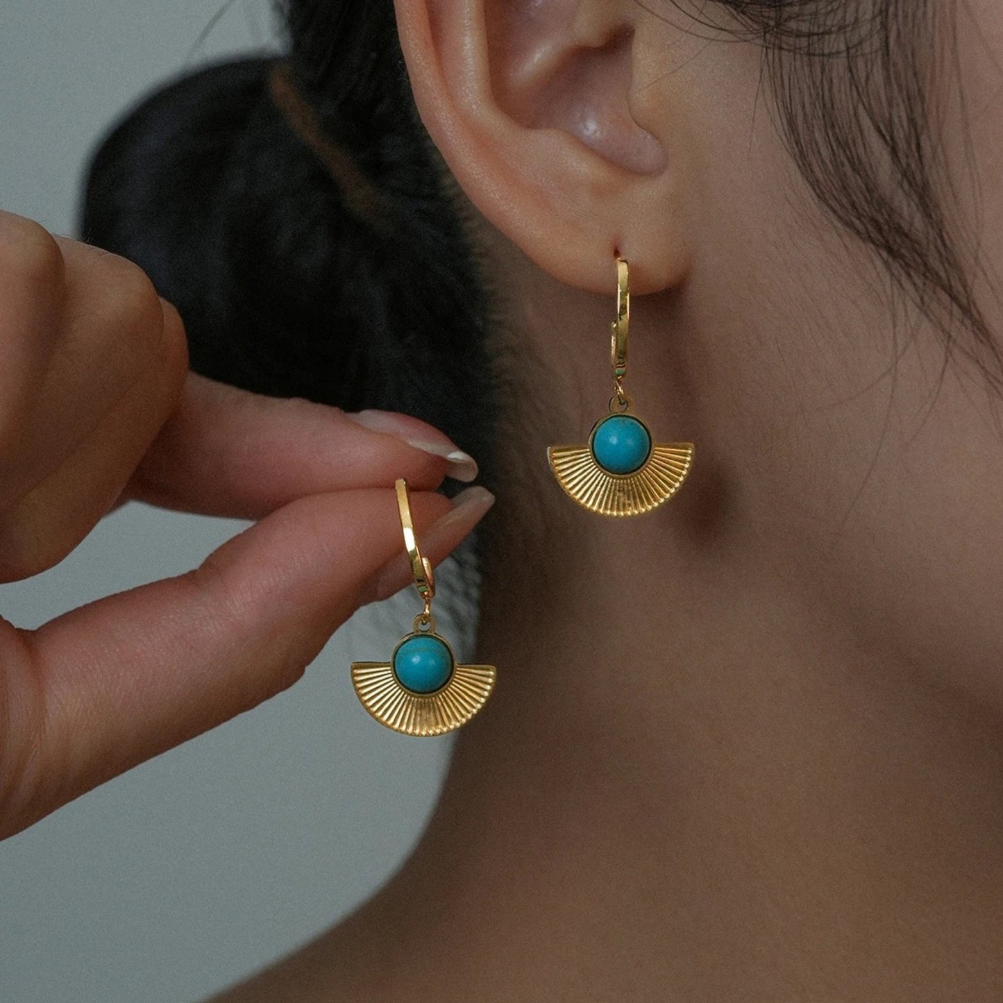 Fan-shaped earrings from the Bohemian Radiance Turquoise Jewelry Set, featuring a natural turquoise stone and intricate 18K gold-plated design.