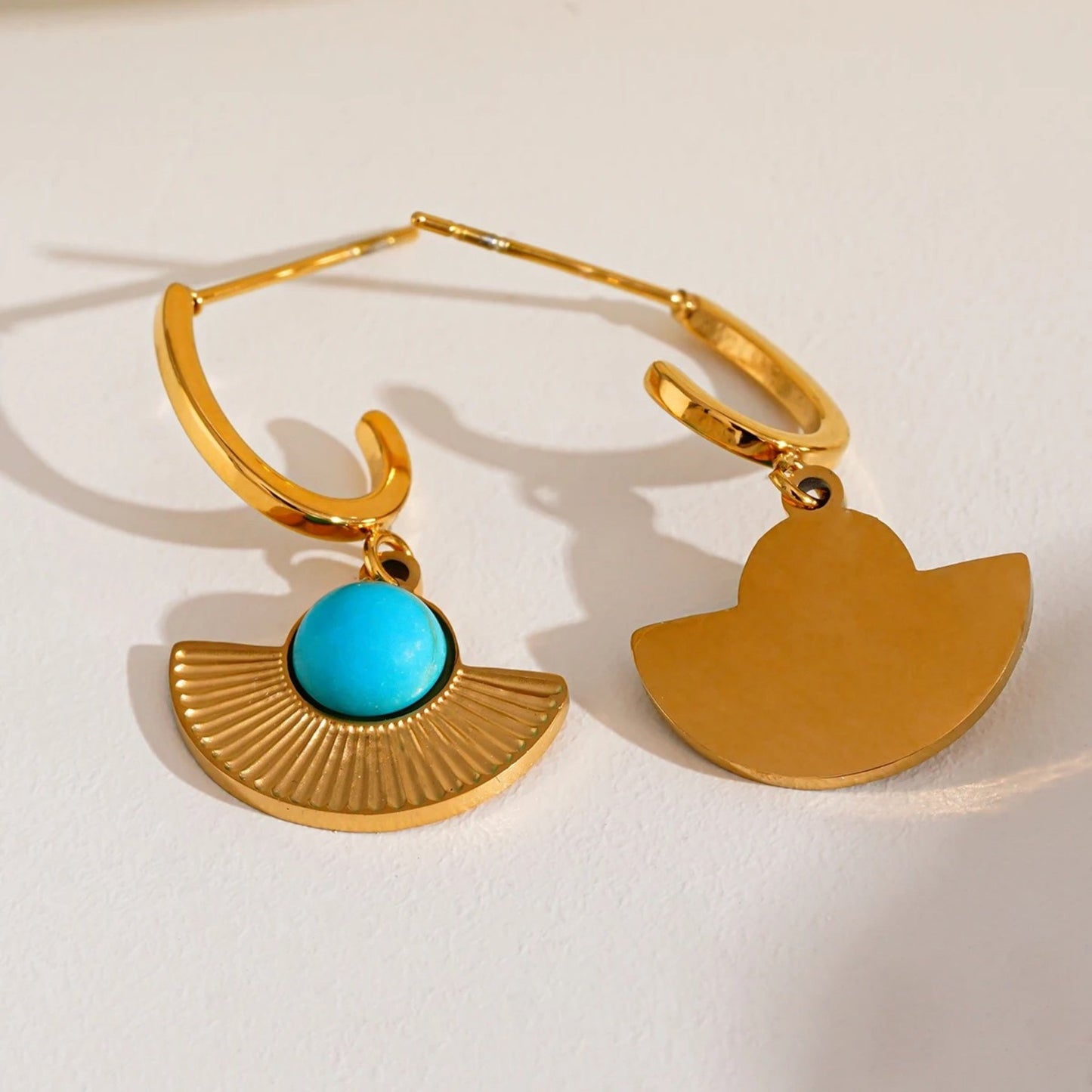 Bohemian Radiance Earrings with a fan-shaped design and natural turquoise stone set in 18K gold-plated stainless steel.