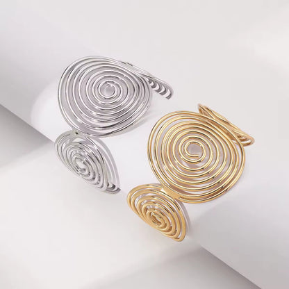 Close-up of the Bohemian Spiral Wire Cuff Bracelet's intricate spiral wire design, crafted with high-quality alloy in gold or silver.