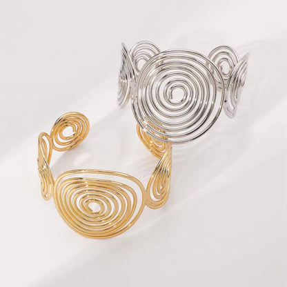 Bohemian Spiral Wire Cuff Bracelet in gold, featuring a retro-inspired spiral wire design and open cuff style for adjustable wear.