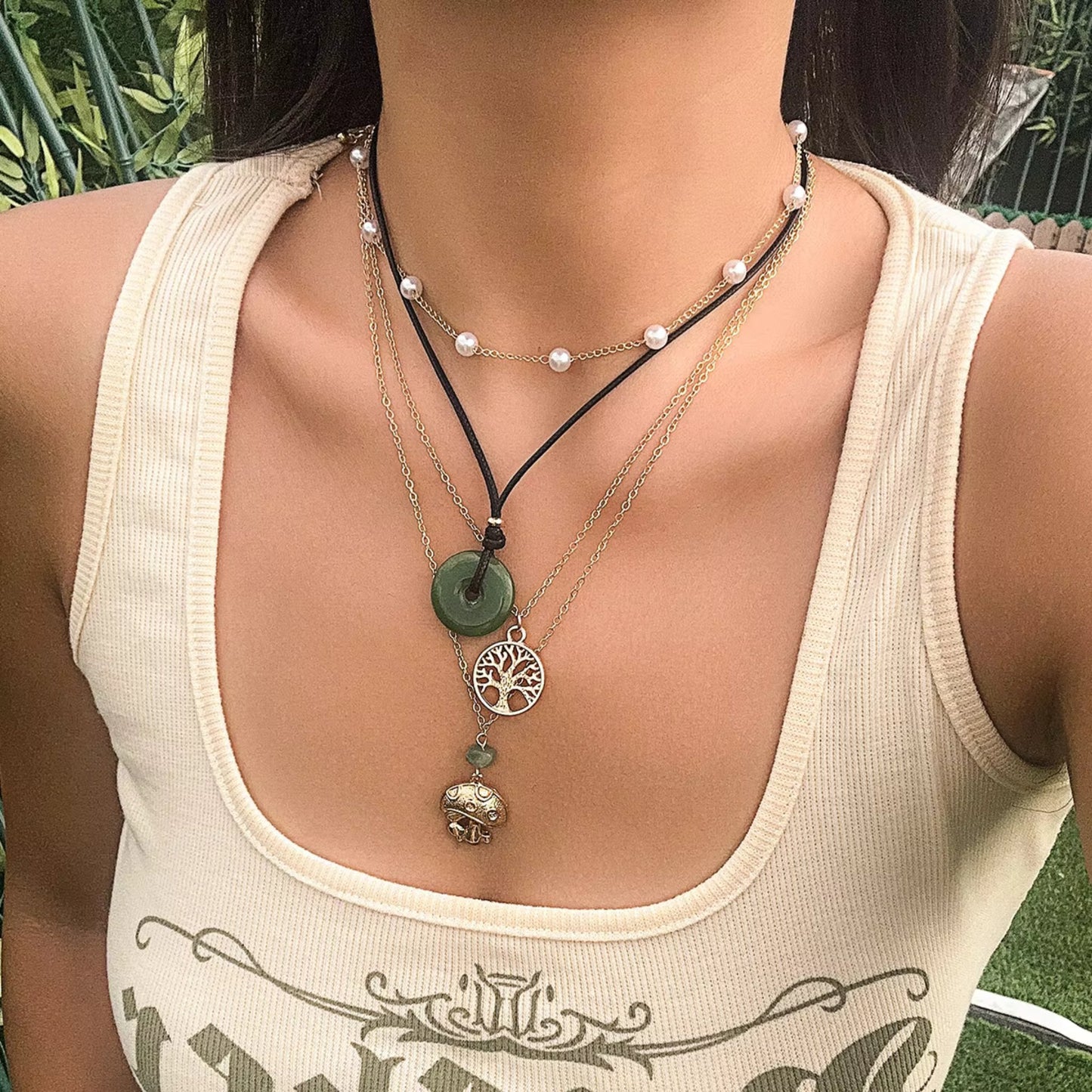 Boho Charm Layered Necklace Set styled on a model, showcasing eclectic layers with colorful charms and bohemian vibes.