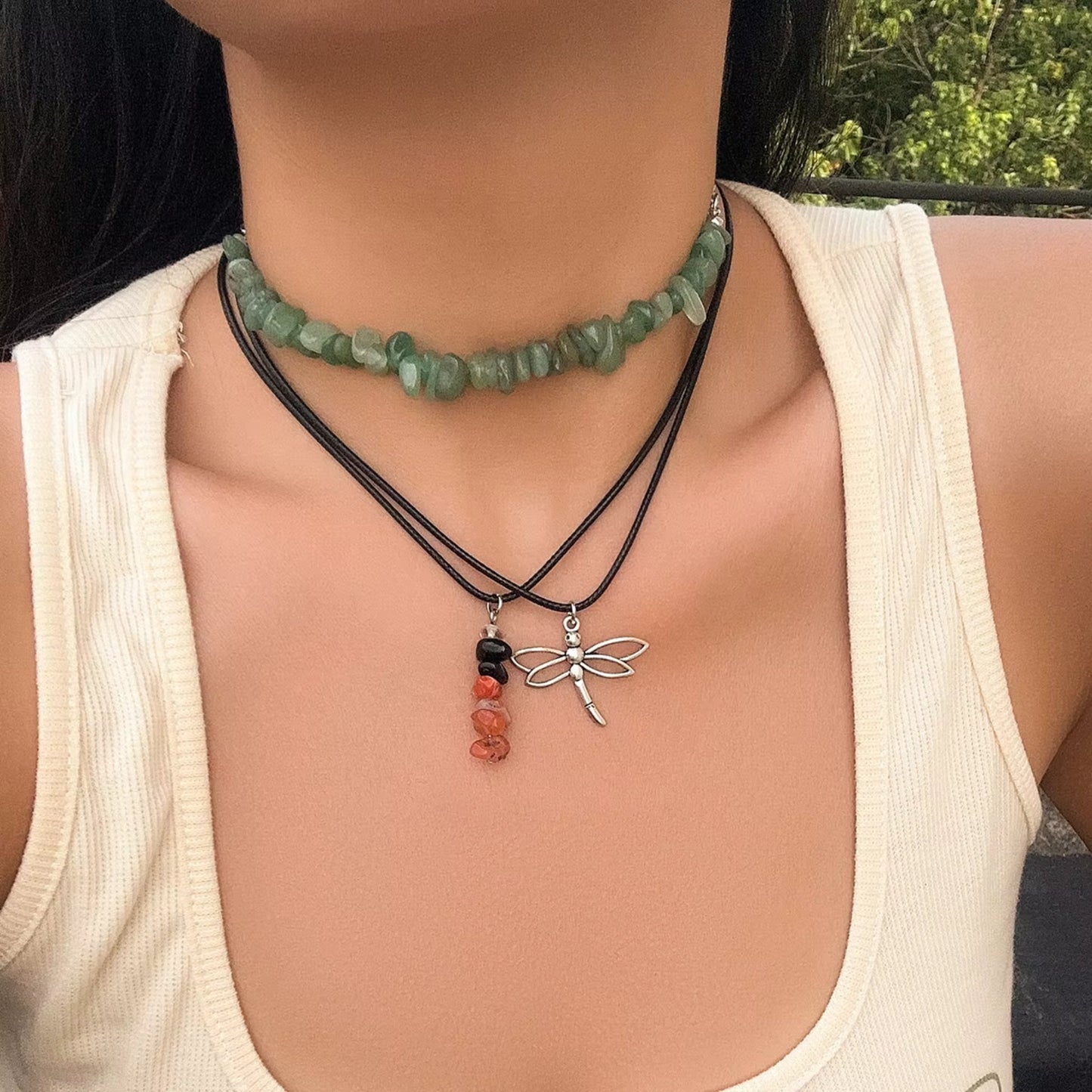 Boho Charm Layered Necklace Set styled on a model, showcasing eclectic layers with colorful charms and bohemian vibes.