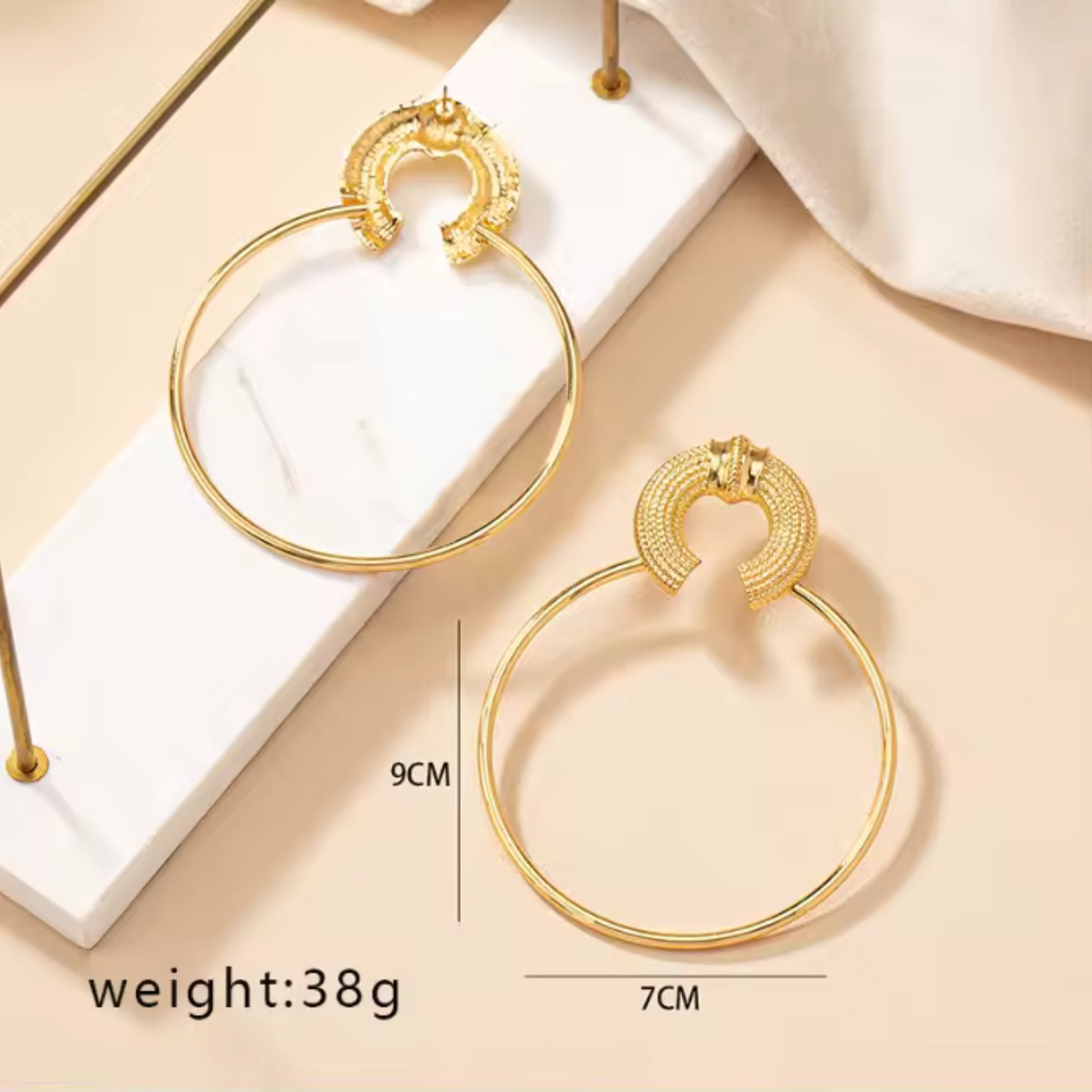 Details for the Oversized Gold Hoop Earrings.