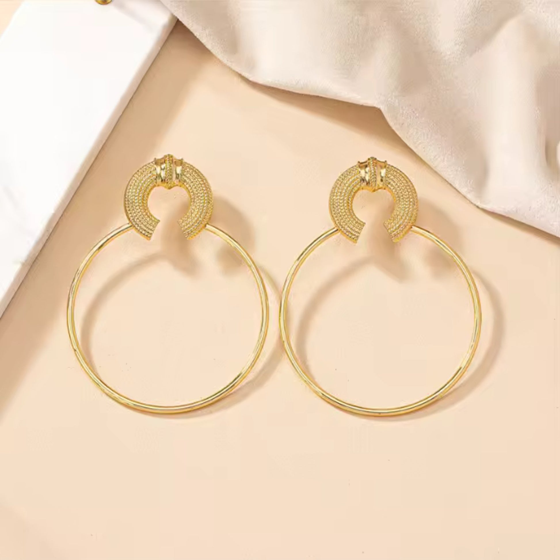 Close-up of Boho Gold Hoop Earrings showcasing textured details and oversized design.