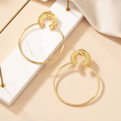 Oversized Gold Hoop Earrings styled for boho-chic or casual outfits, making a bold statement.