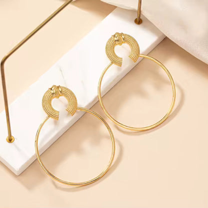 Oversized Gold Hoop Earrings styled for boho-chic or casual outfits, making a bold statement.