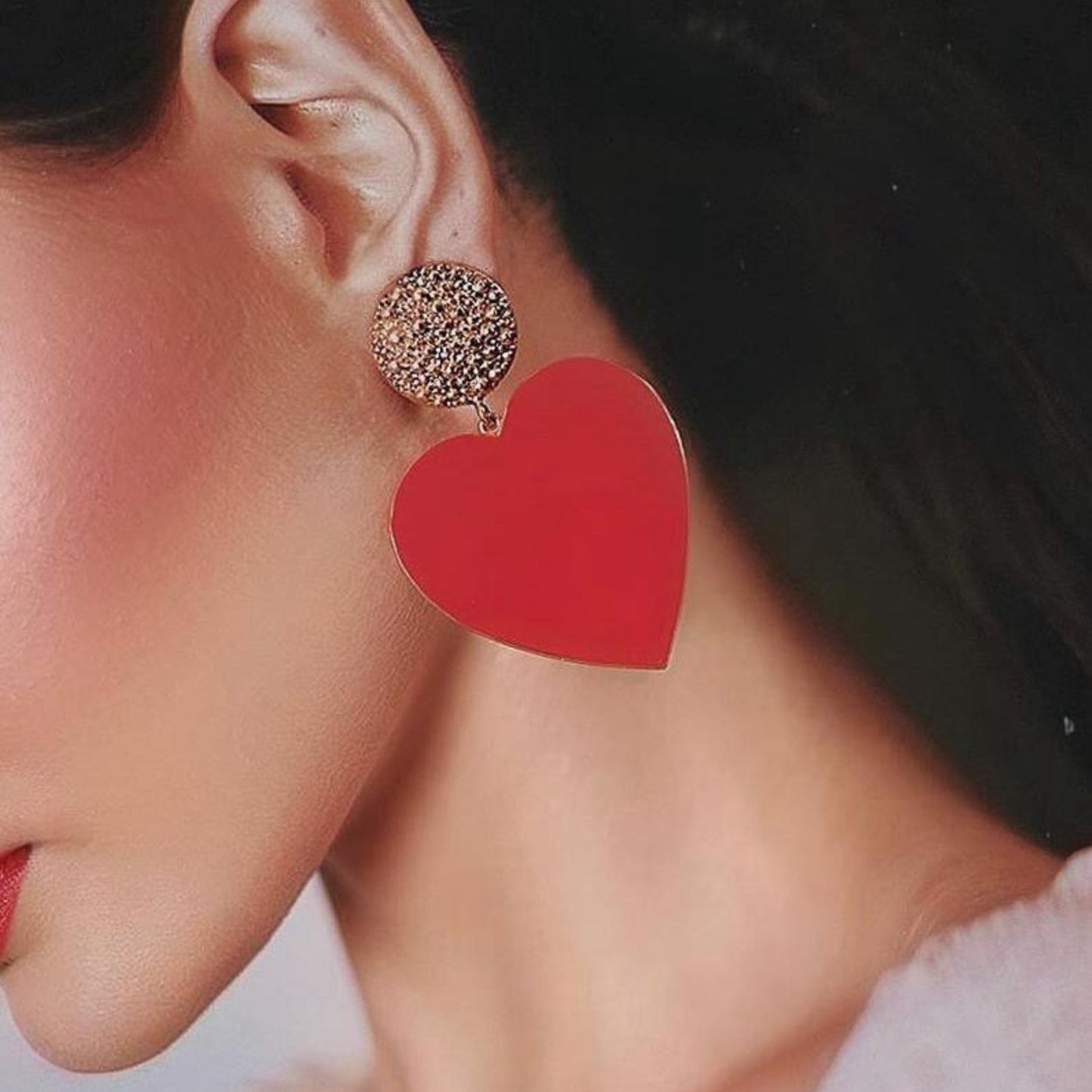Bold Heart Acrylic Drop Earrings styled on a model, showcasing their large heart shape and vibrant blue color.