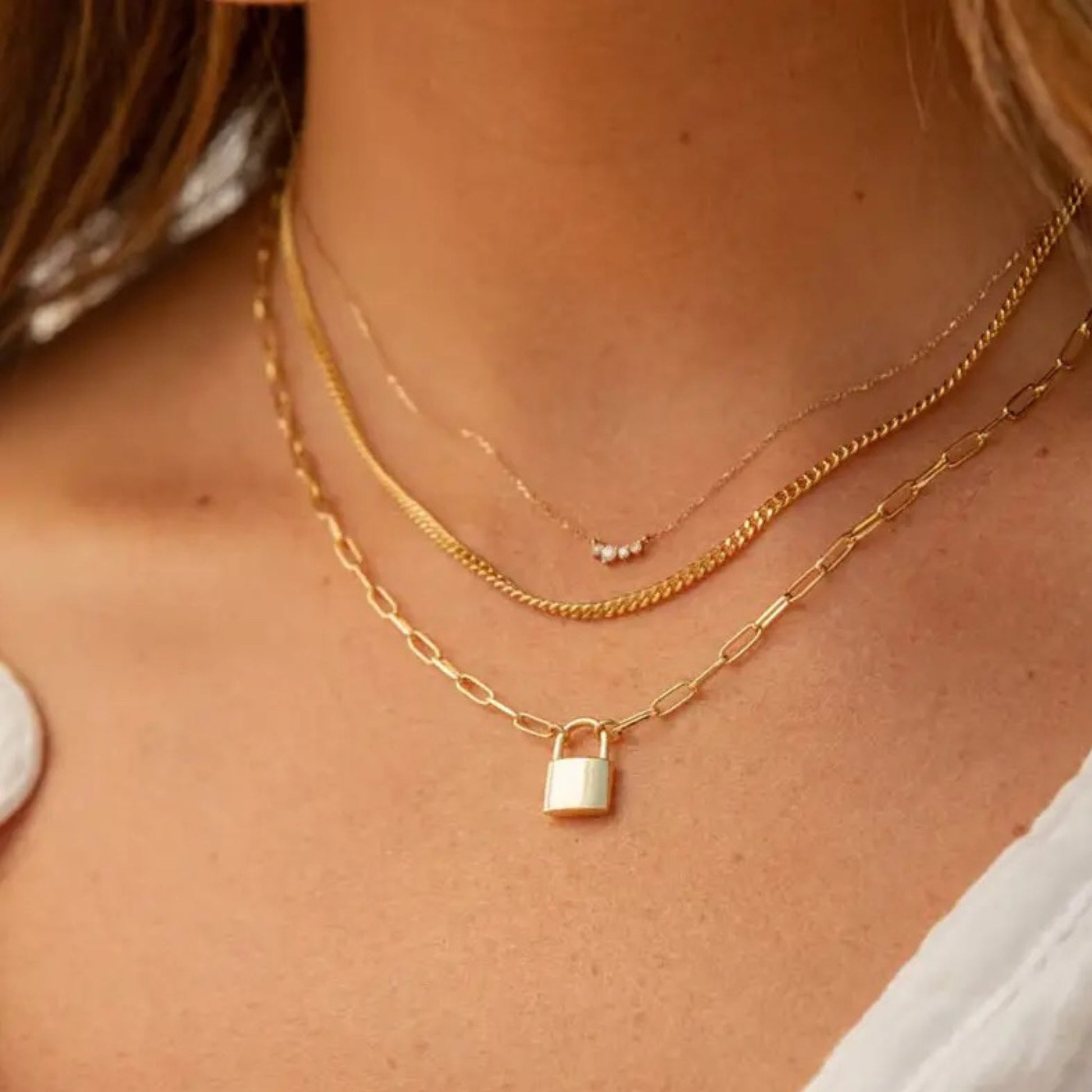 Lock Pendant Necklace styled for casual or formal looks, adding a modern touch.
